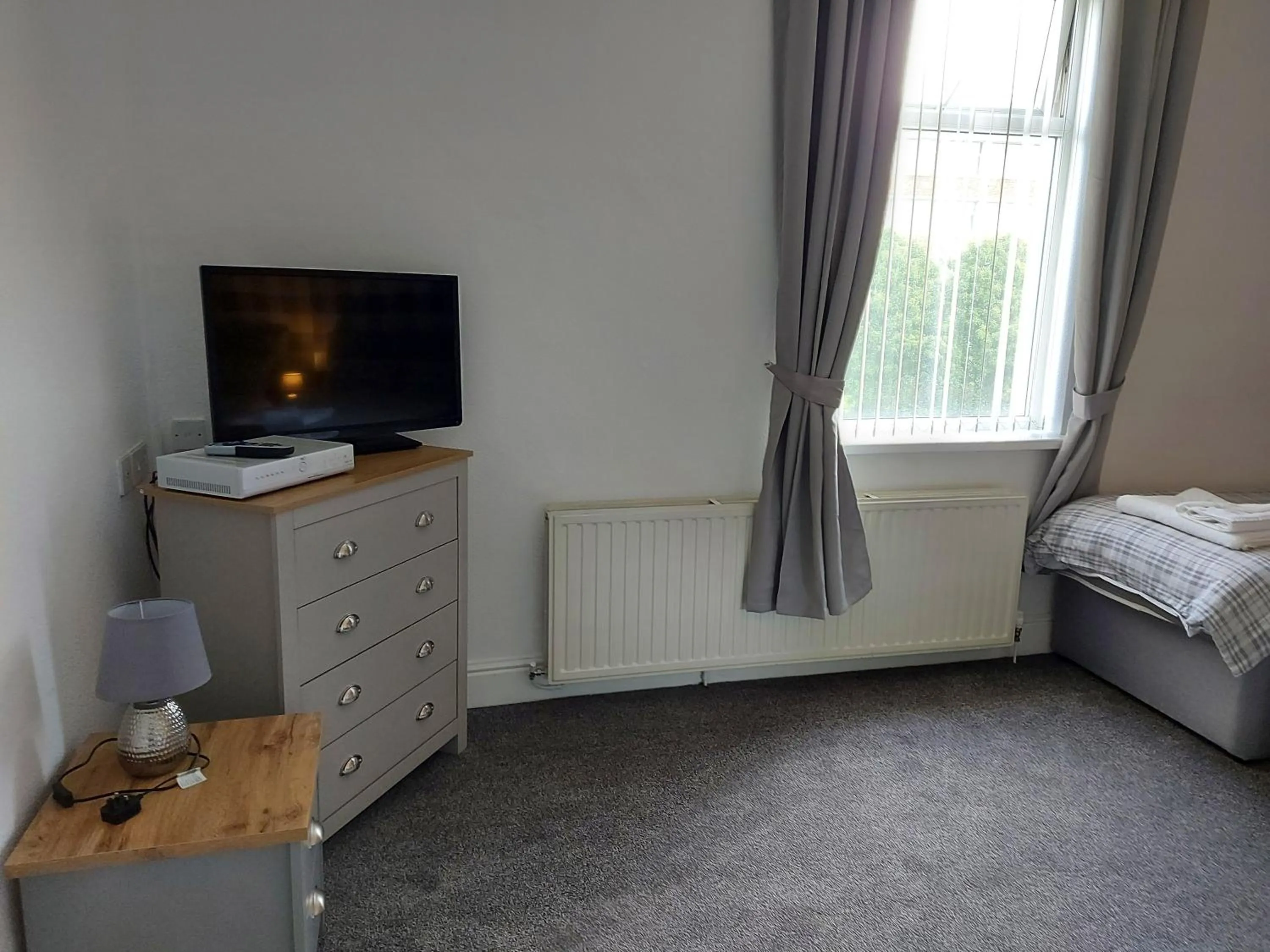 Bed in Ambrose Hotel