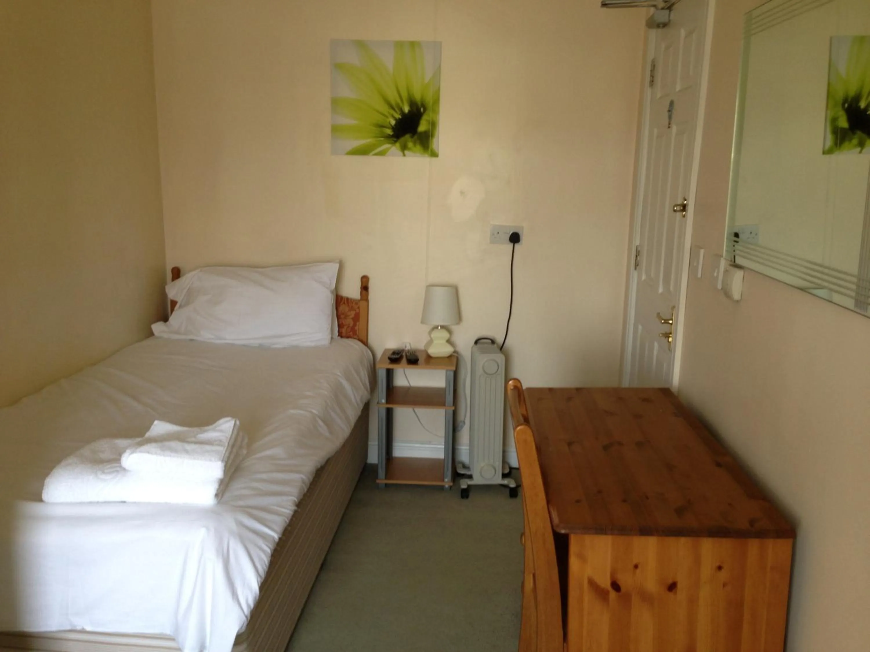 Bed in Ambrose Hotel