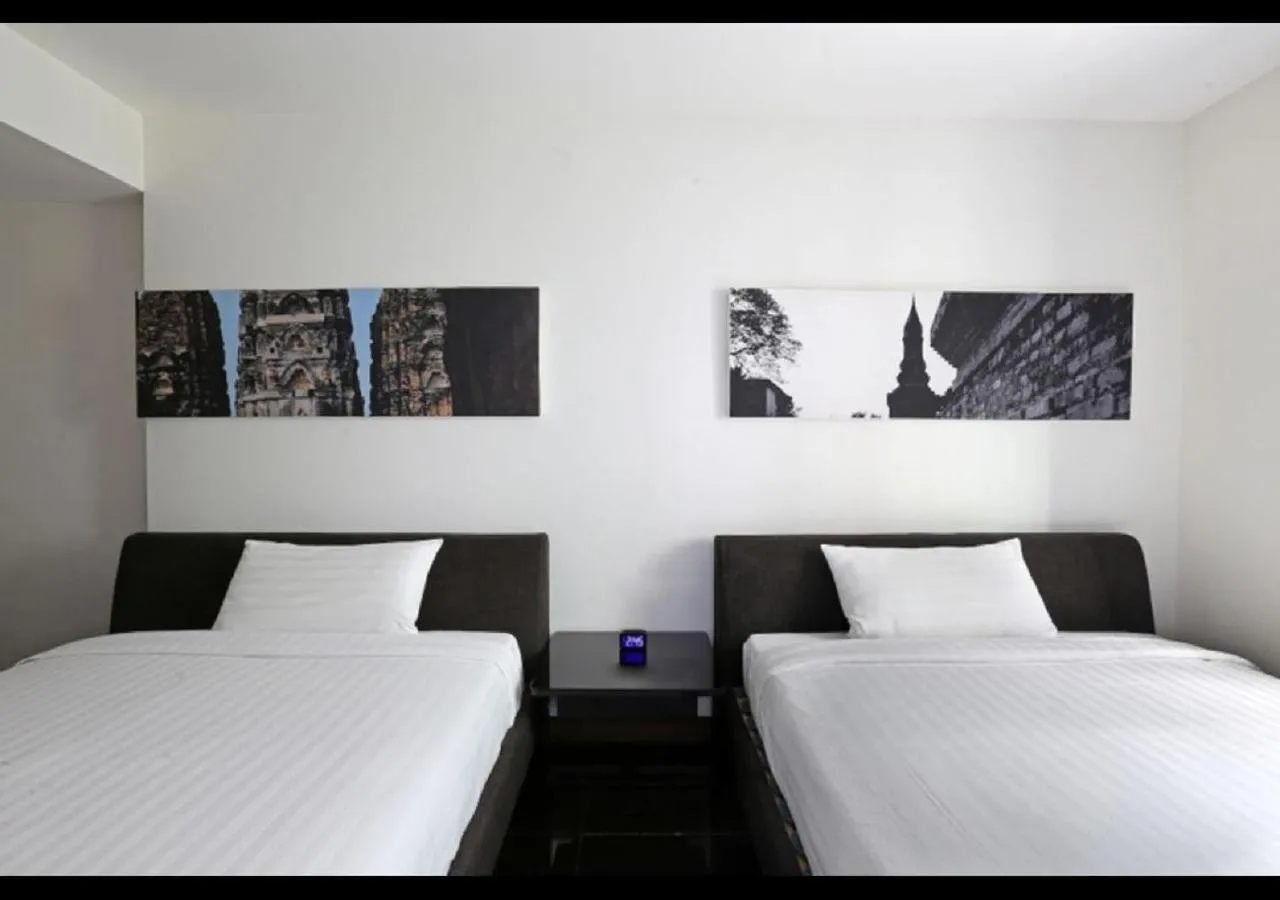 Bed in S33 Compact Sukhumvit Hotel