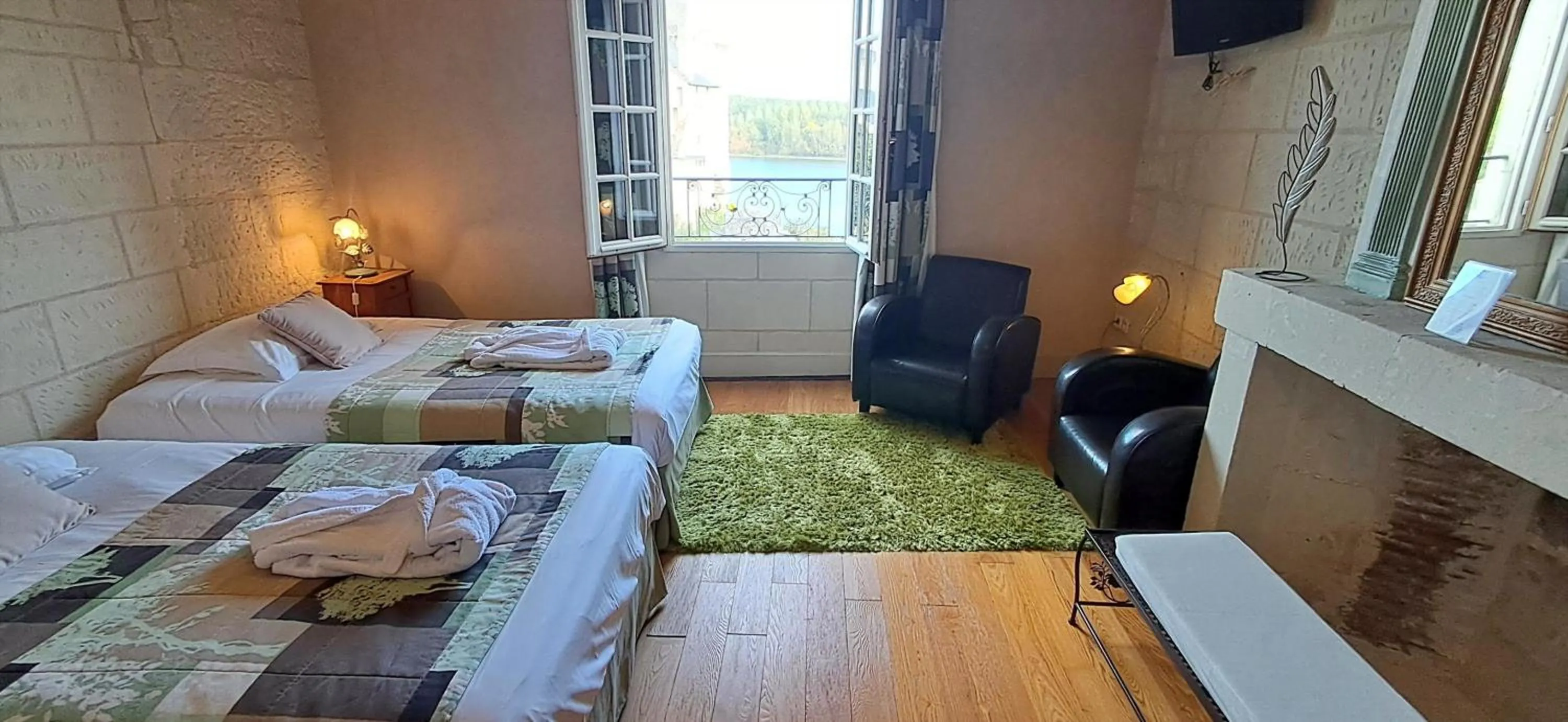 Bed in Logis Hôtel Le Bussy