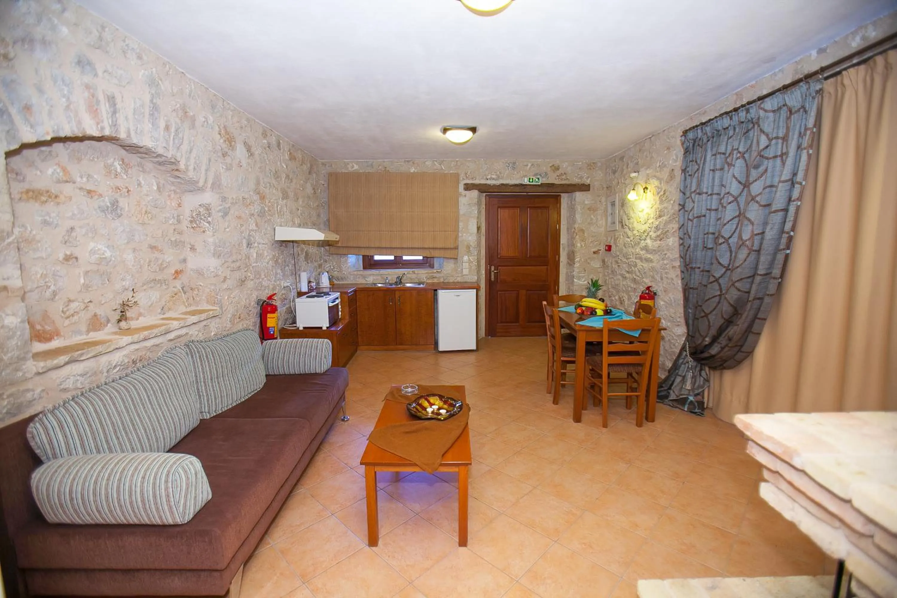 Seating area, Bed in Anigraia