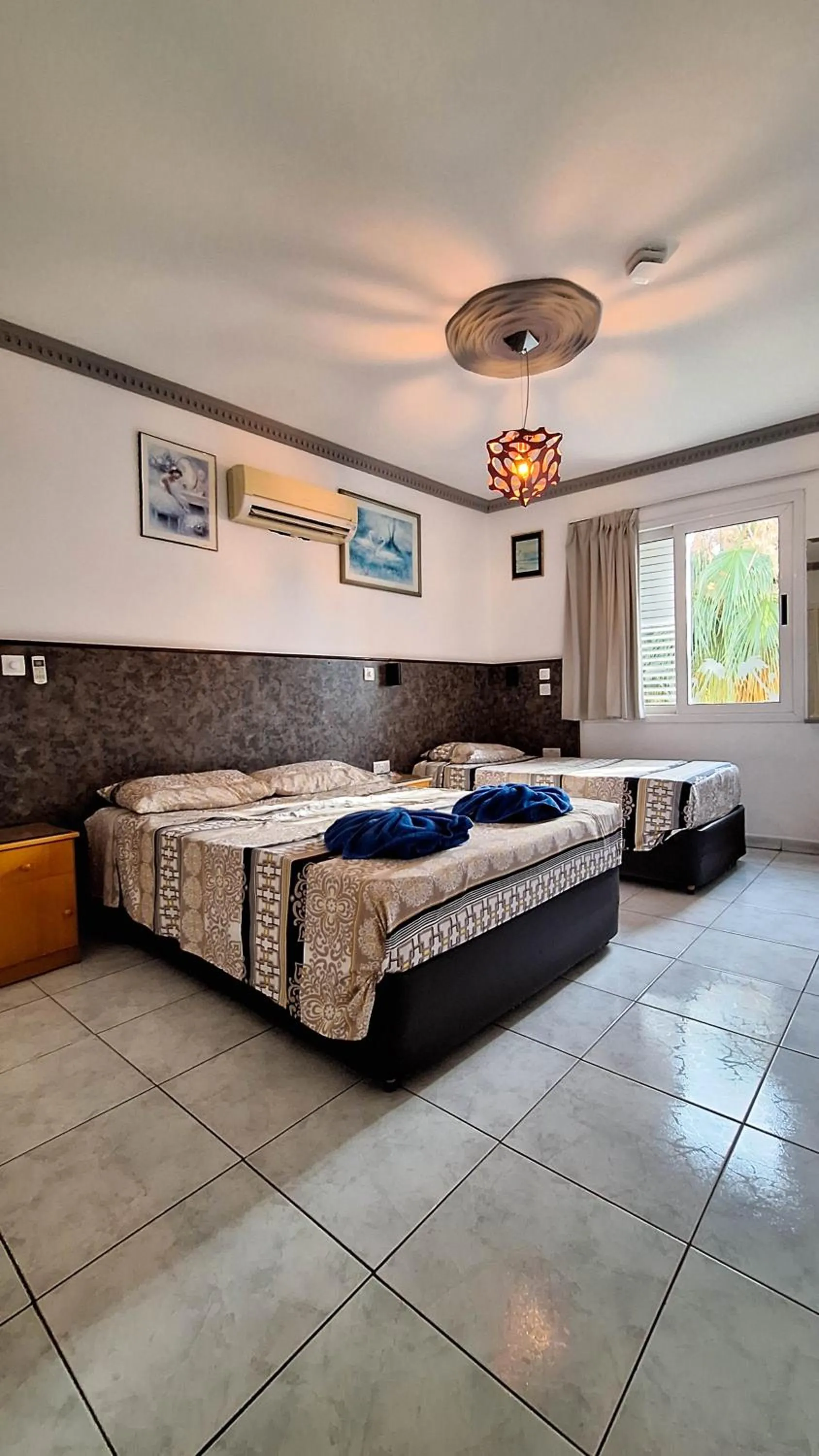 Bed in Apollonia Hotel Apartments