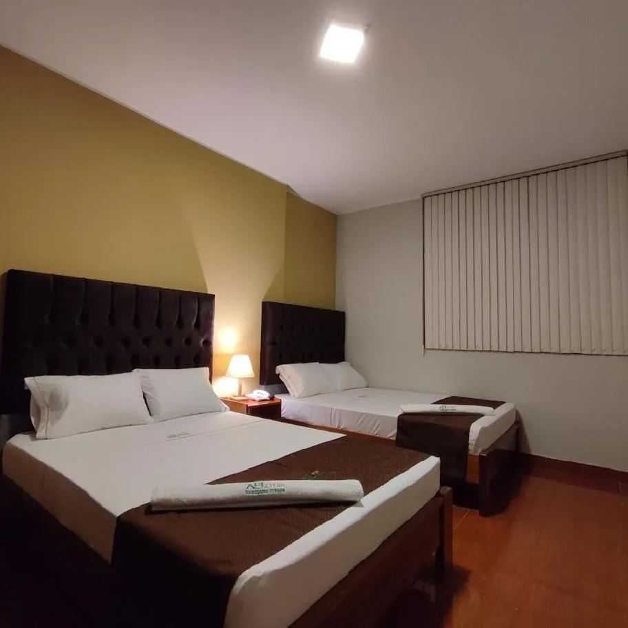 Bed in Hotel Puerto Amazonico