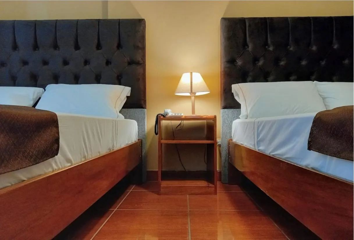 Bed in Hotel Puerto Amazonico