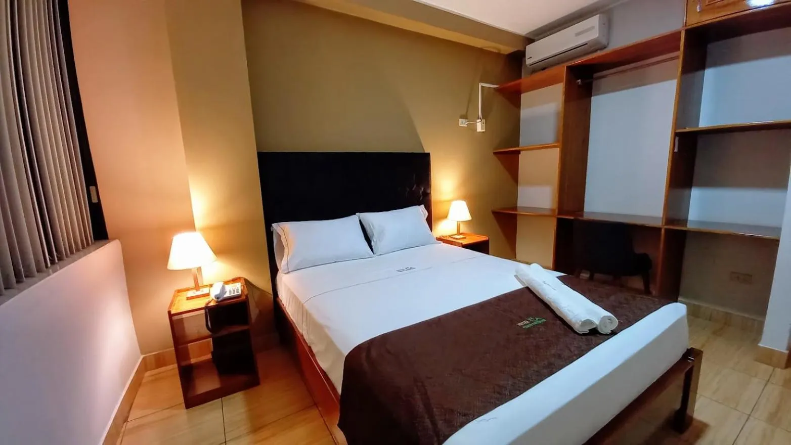 Bed in Hotel Puerto Amazonico