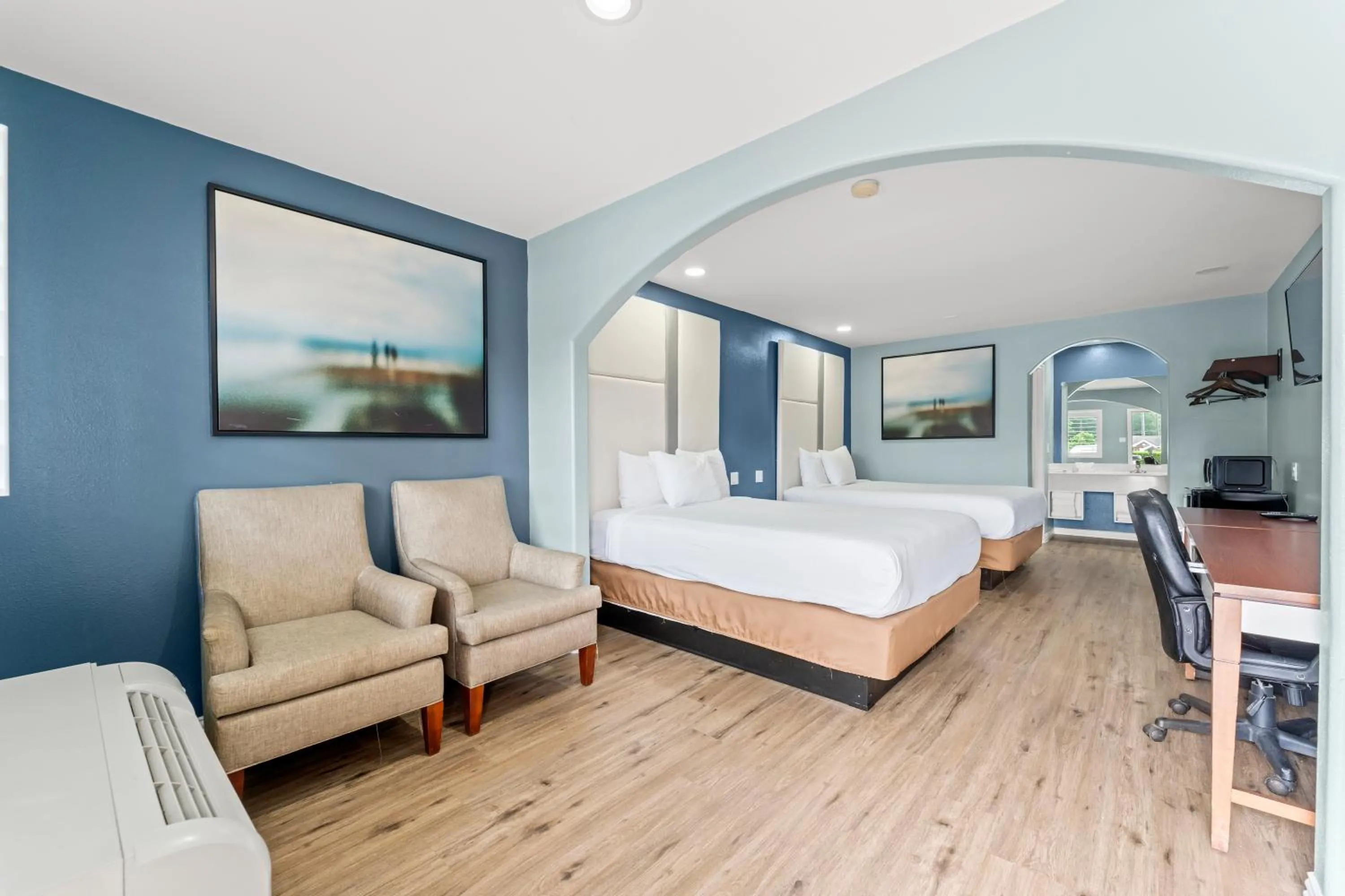 Bed in Executive Inn & Suites Magnolia