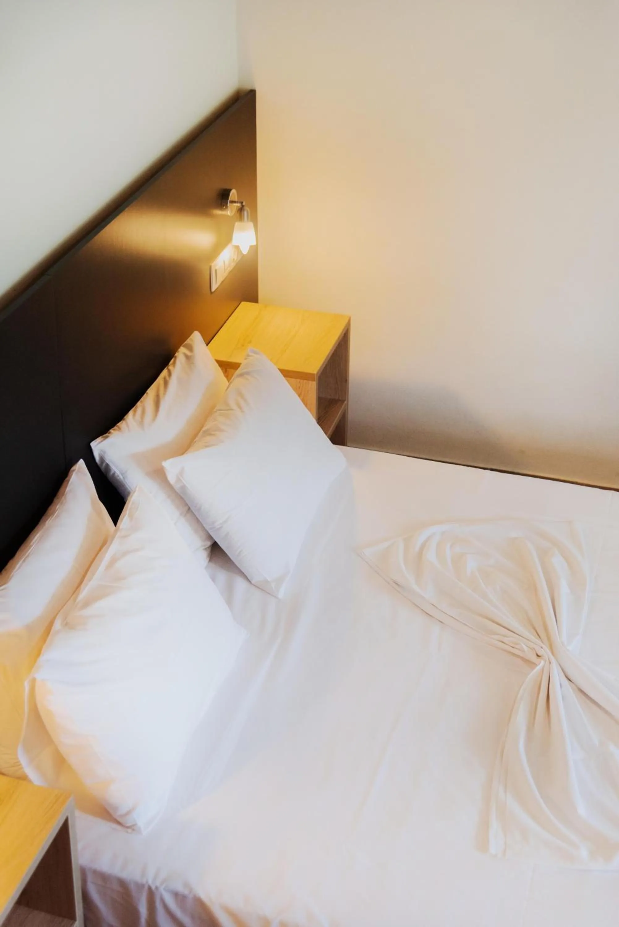 Bed in Riposo Studios & Apartments