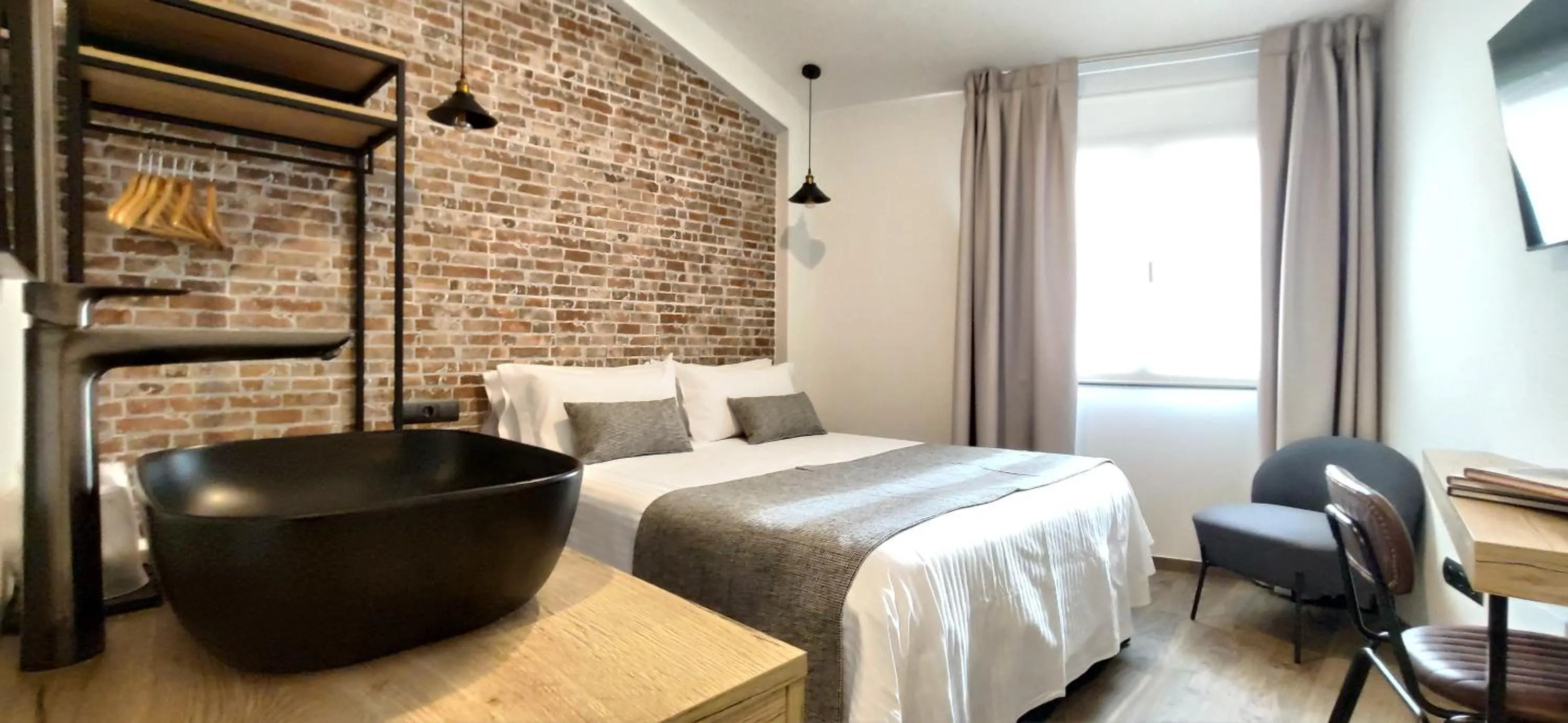 Bed in Le Petit Boutique Hotel