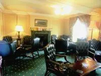 Communal lounge/ TV room in Bishopsgate House Hotel