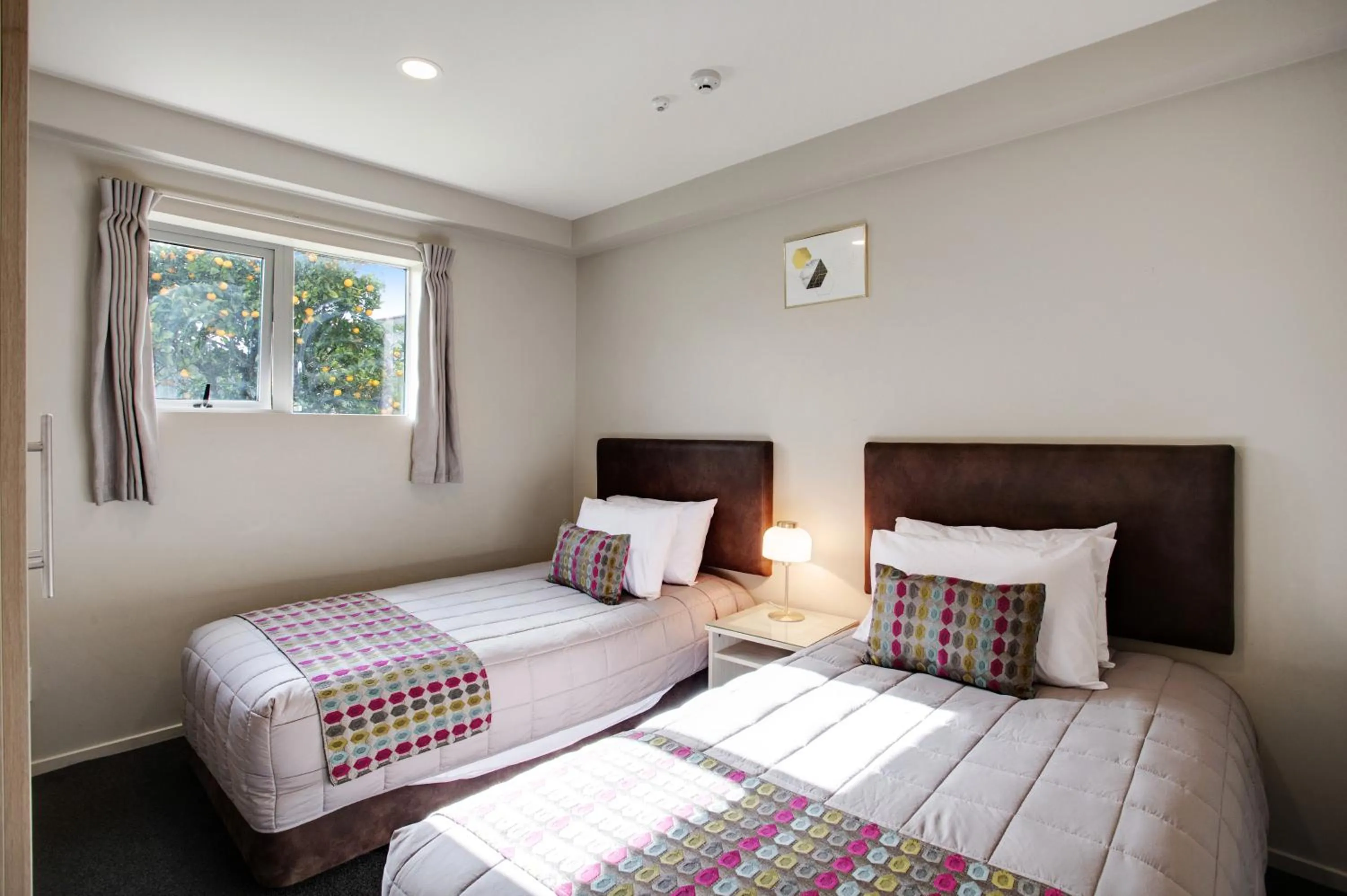 Bed in Ellerslie Palms Motel