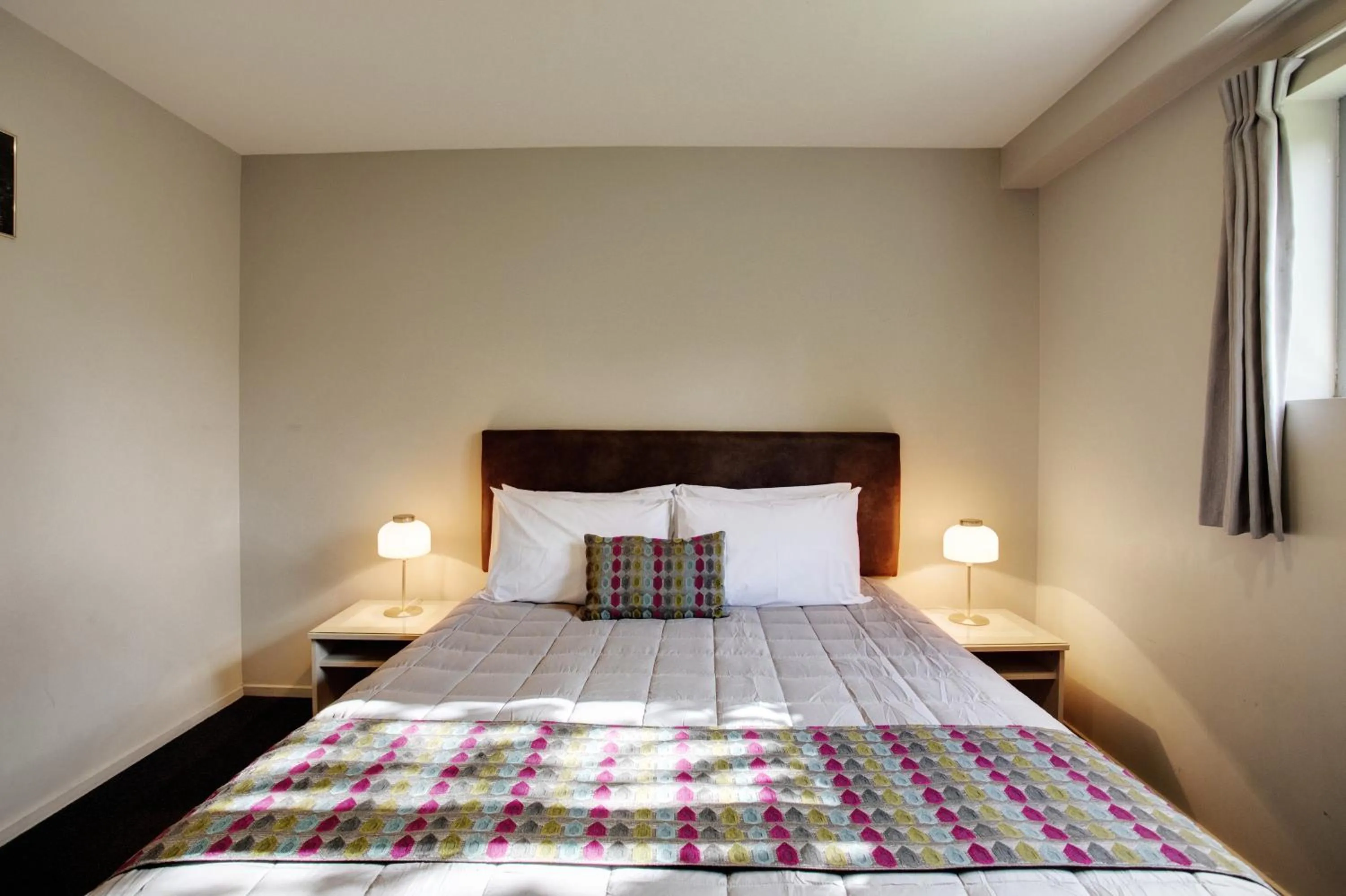 Bed in Ellerslie Palms Motel