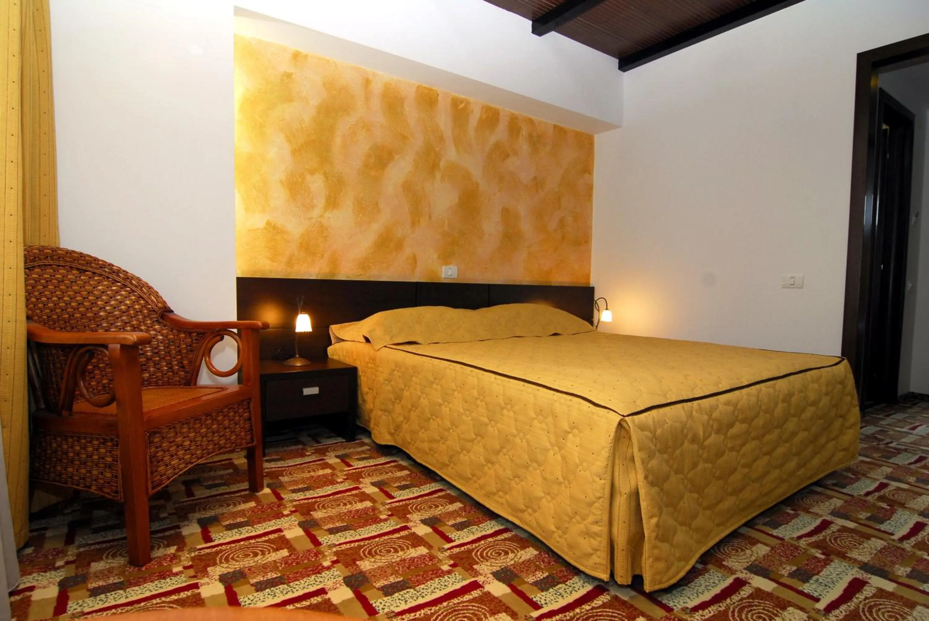 Bed in Casa Iris-Hotel & Restaurant