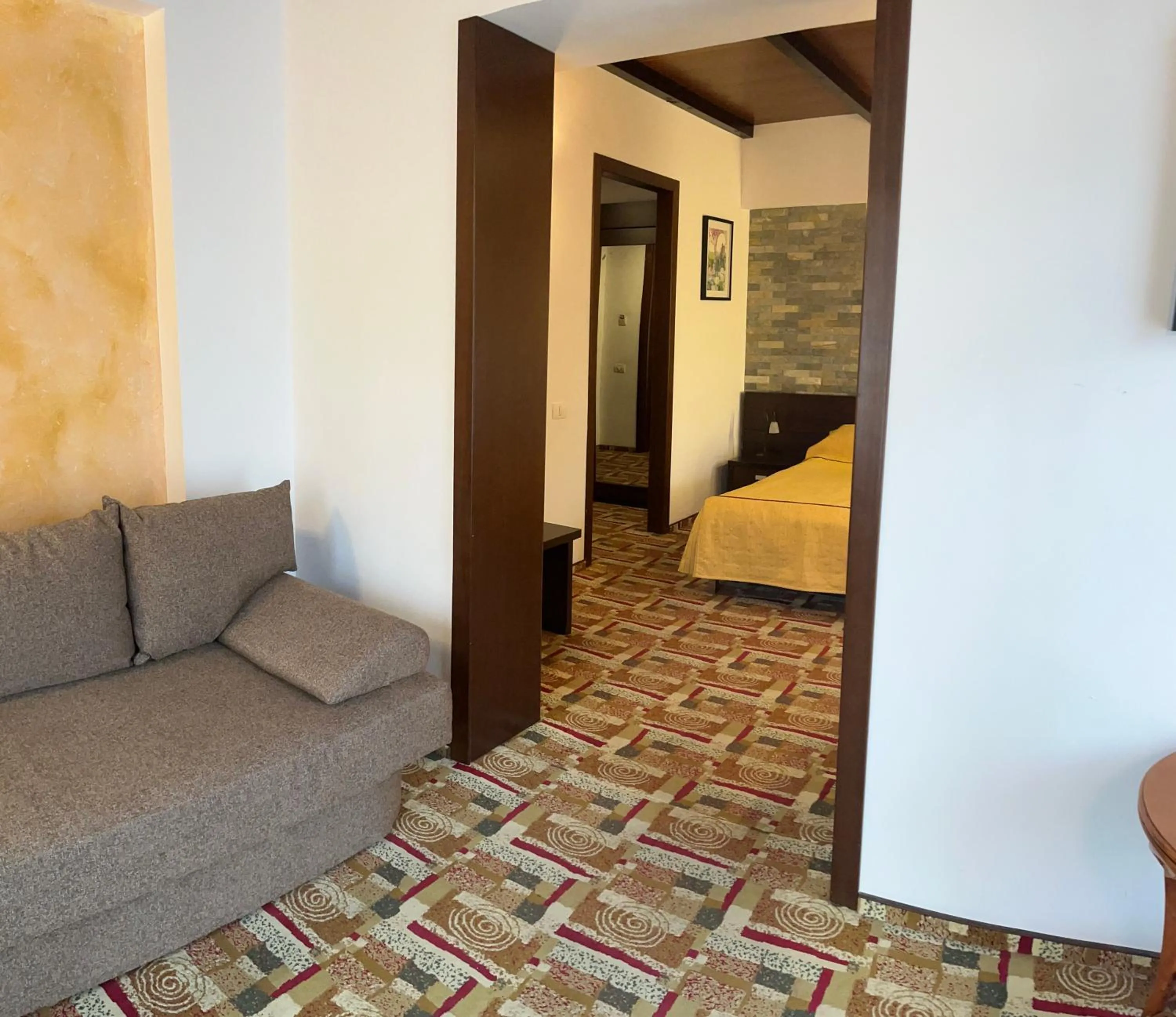 Living room, Bed in Casa Iris-Hotel & Restaurant