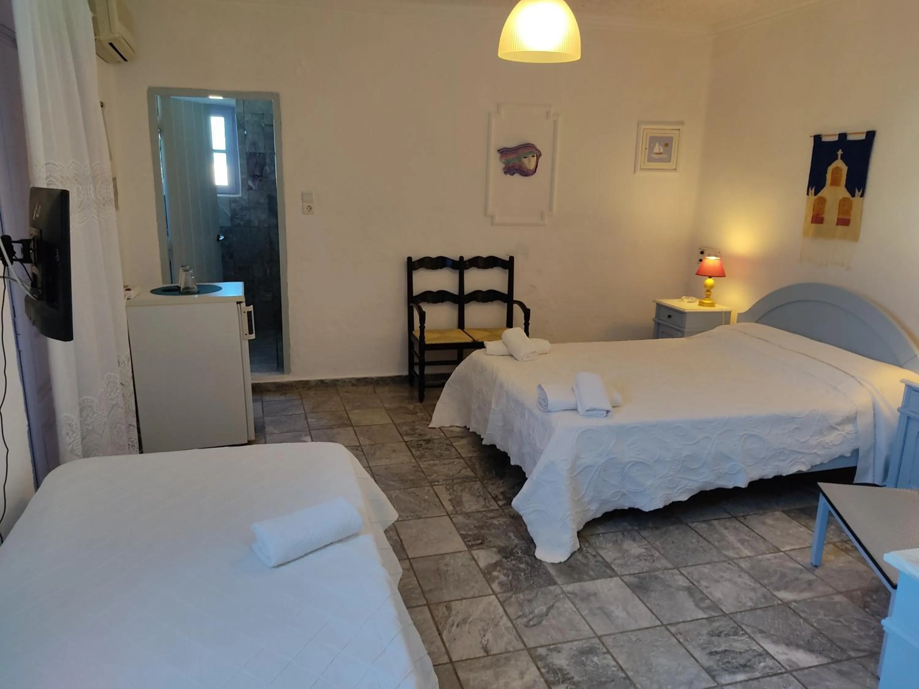 Bed in Porto Sikinos Hotel