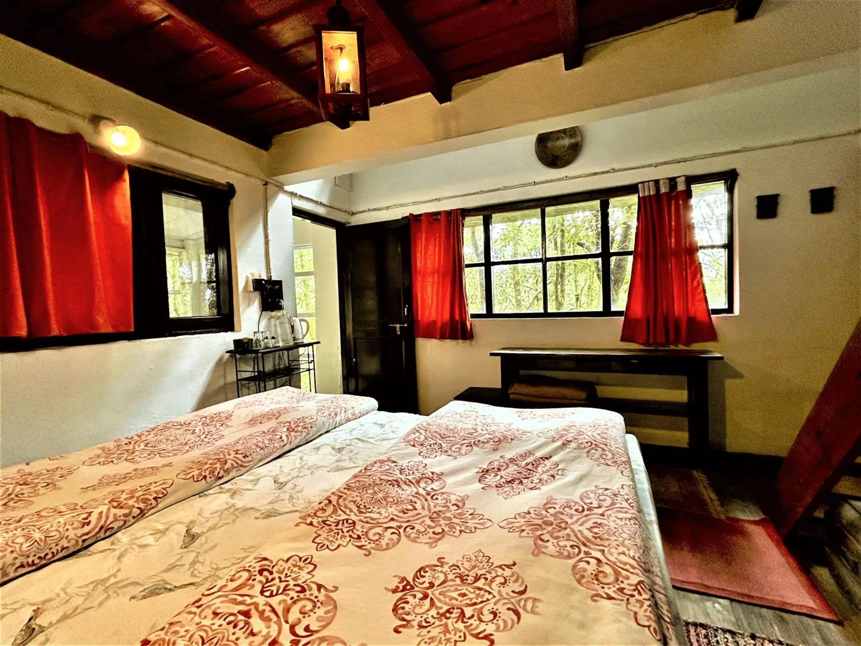 Bed in Jungle Lore Birding Lodge