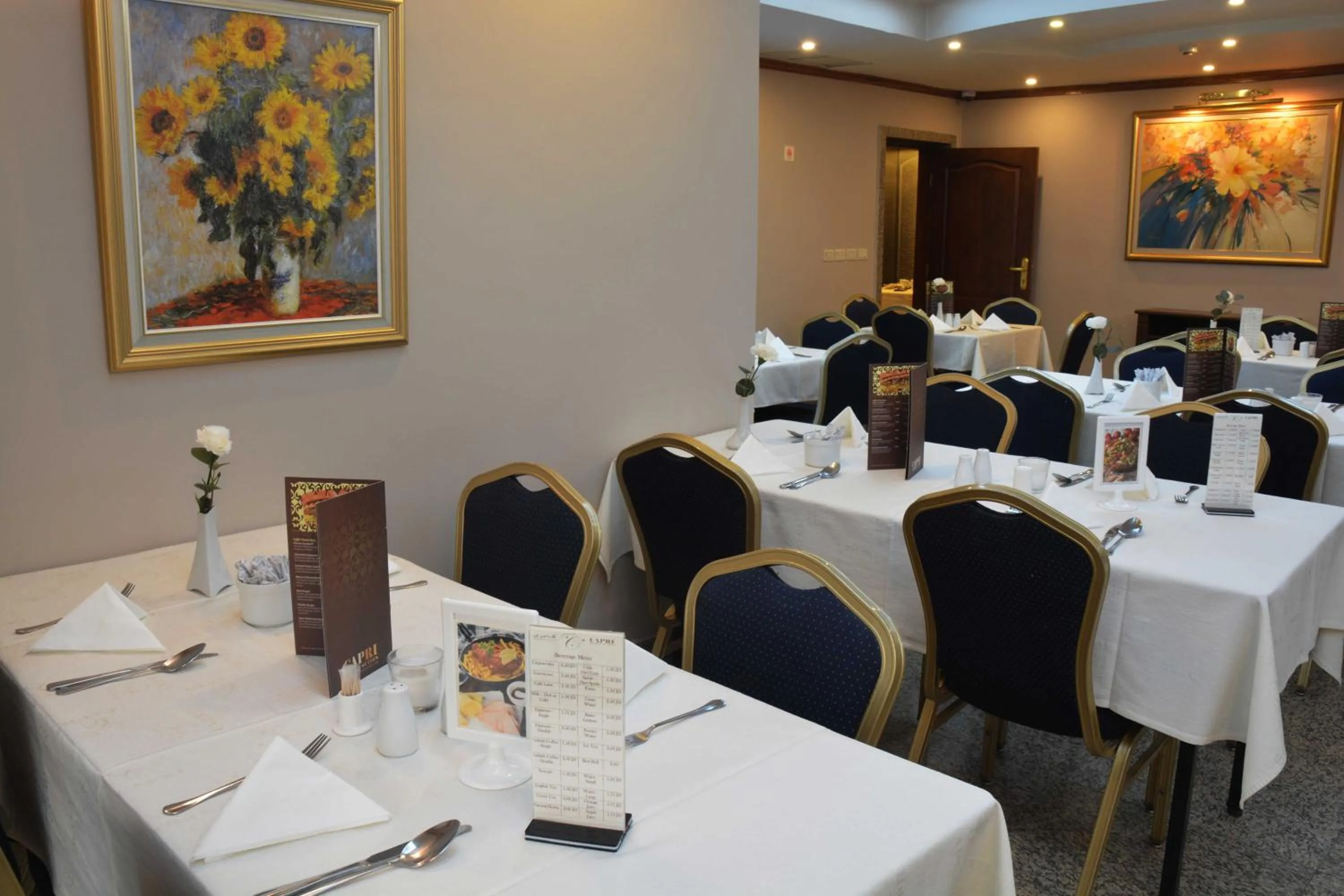 Dining area in Capri Hotel Suites