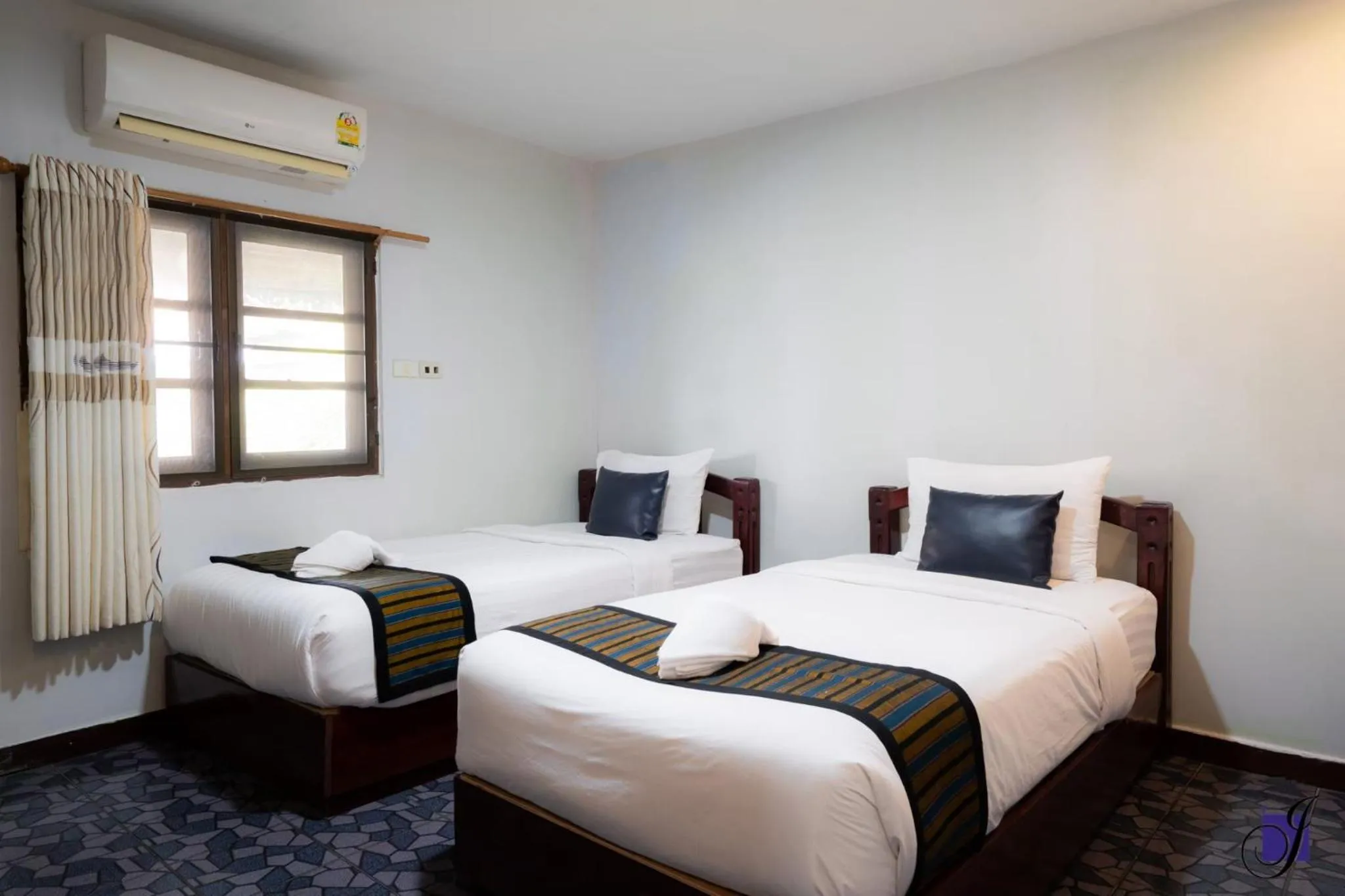 Bed in Jintana Resort