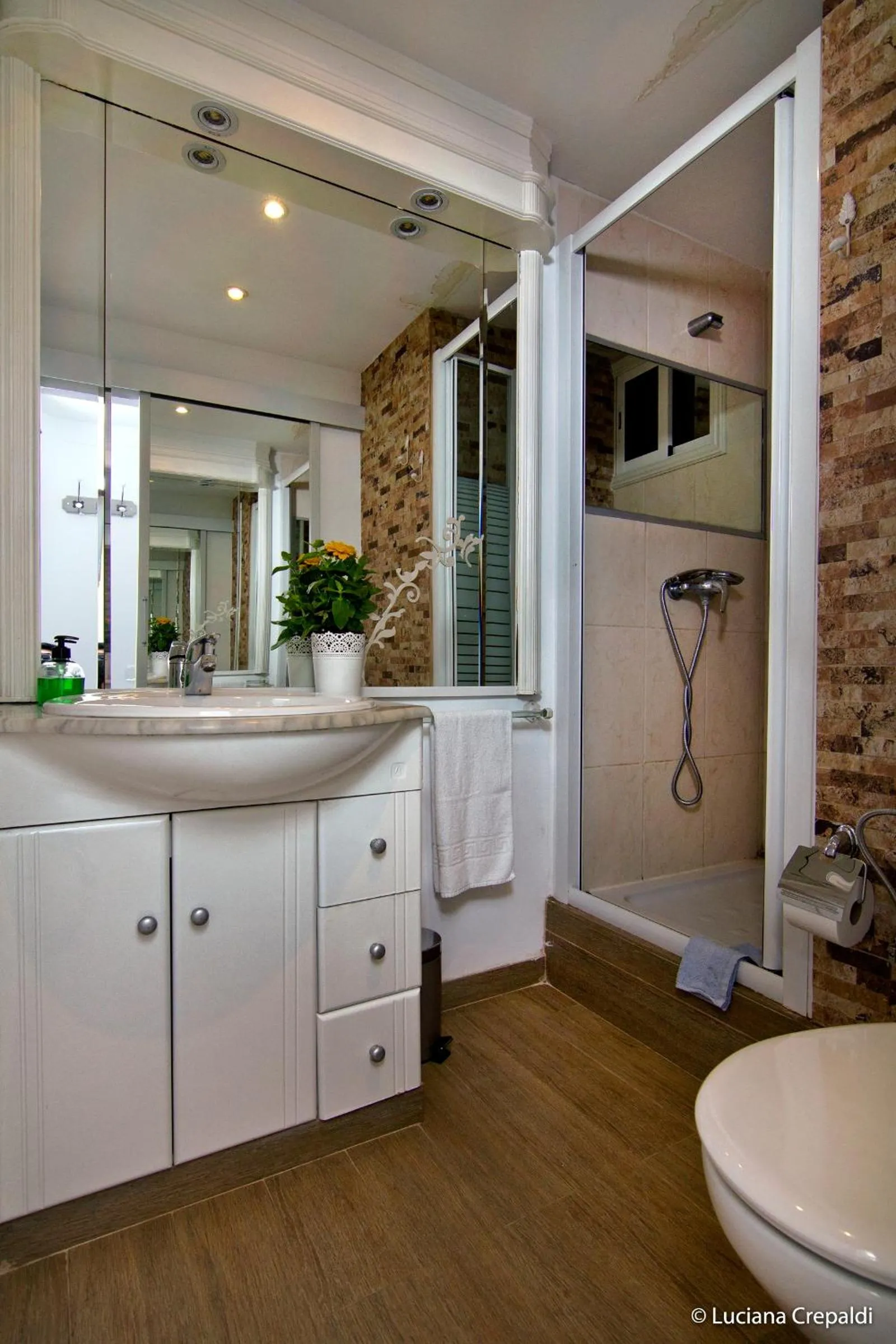 Bathroom in Casa Consell Apartments