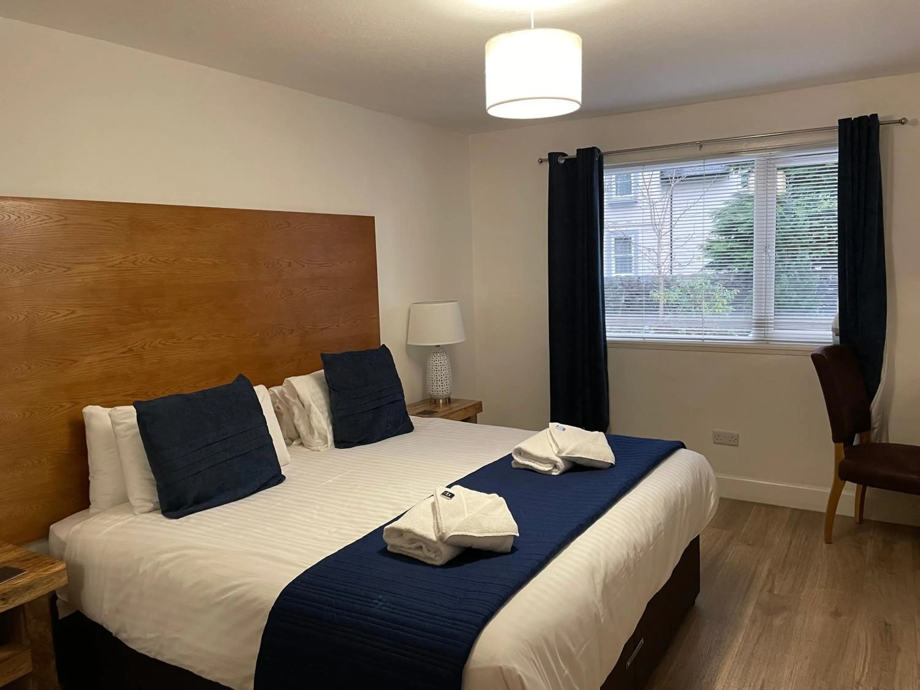 Bed in The Claymore Guest House