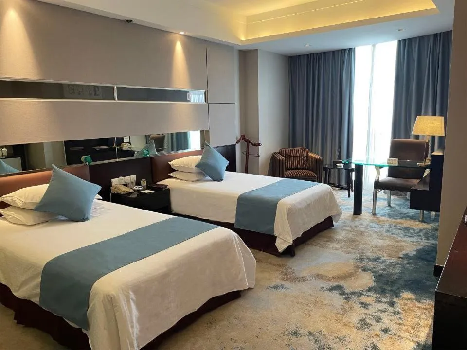 Bed in Royal Palace Hotel Haining