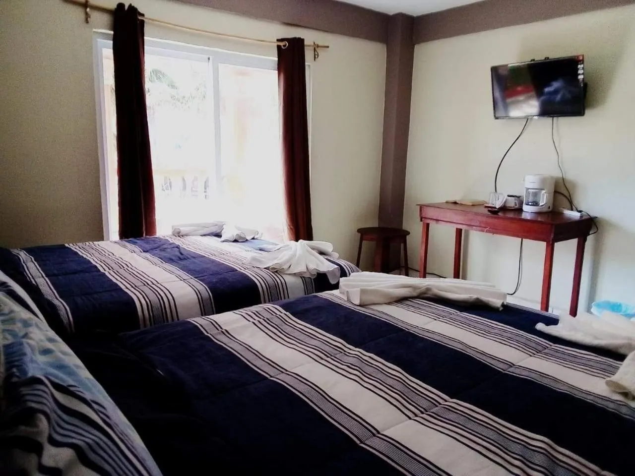 Bed in La Delphina Bed and Breakfast Bar and Grill