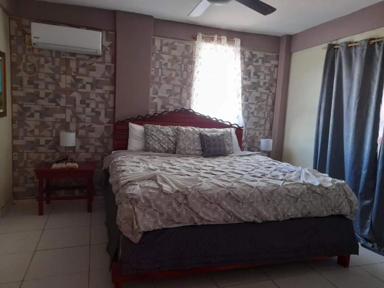 Bed in La Delphina Bed and Breakfast Bar and Grill