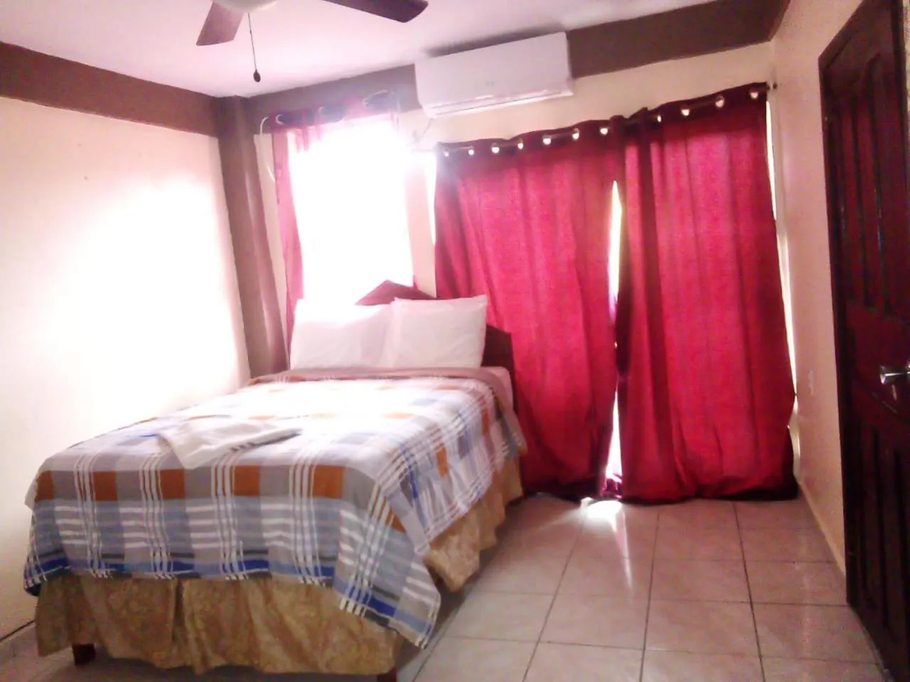 Bed in La Delphina Bed and Breakfast Bar and Grill