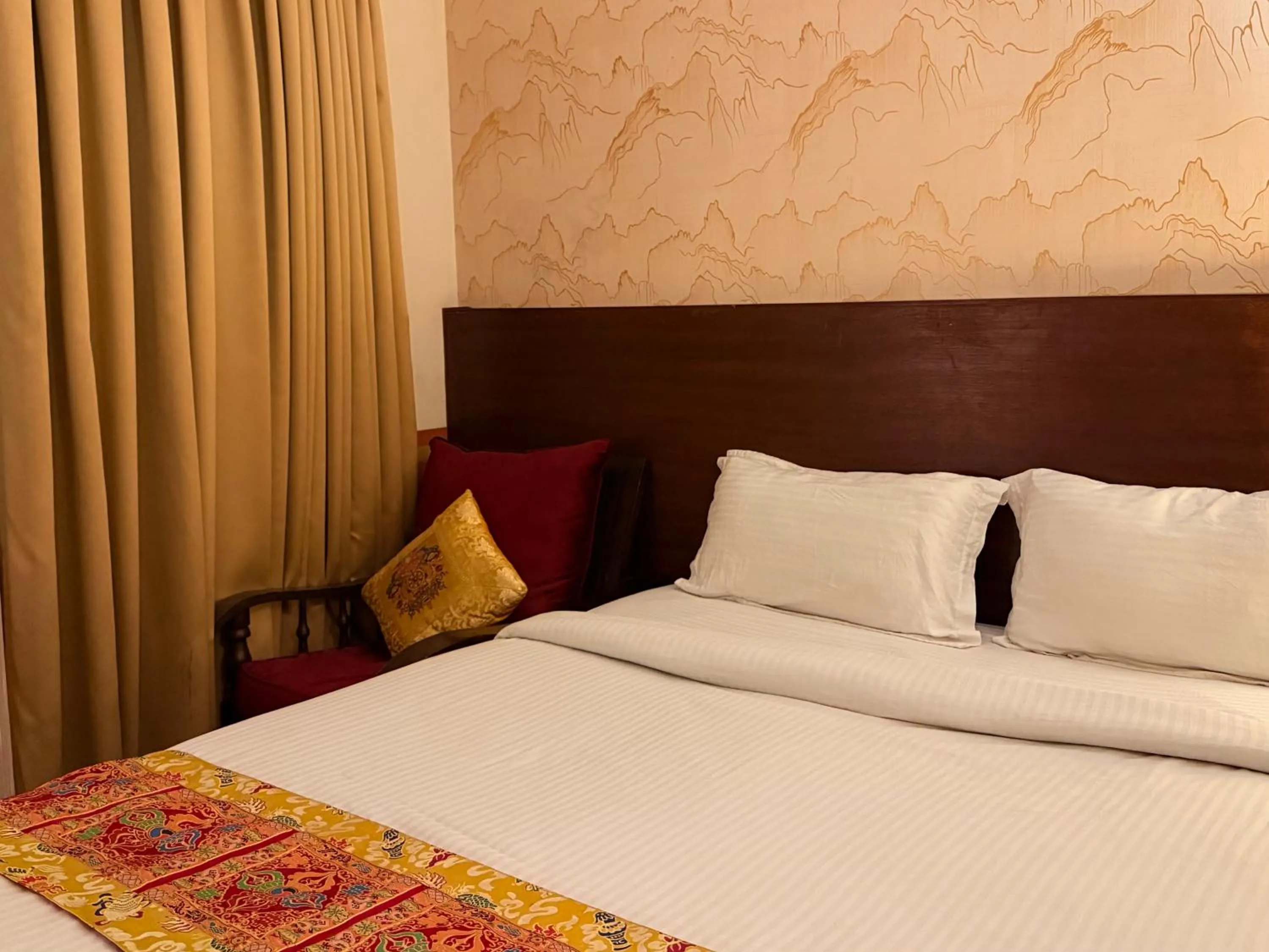 Bed in Three Jewels Boutique Hotel