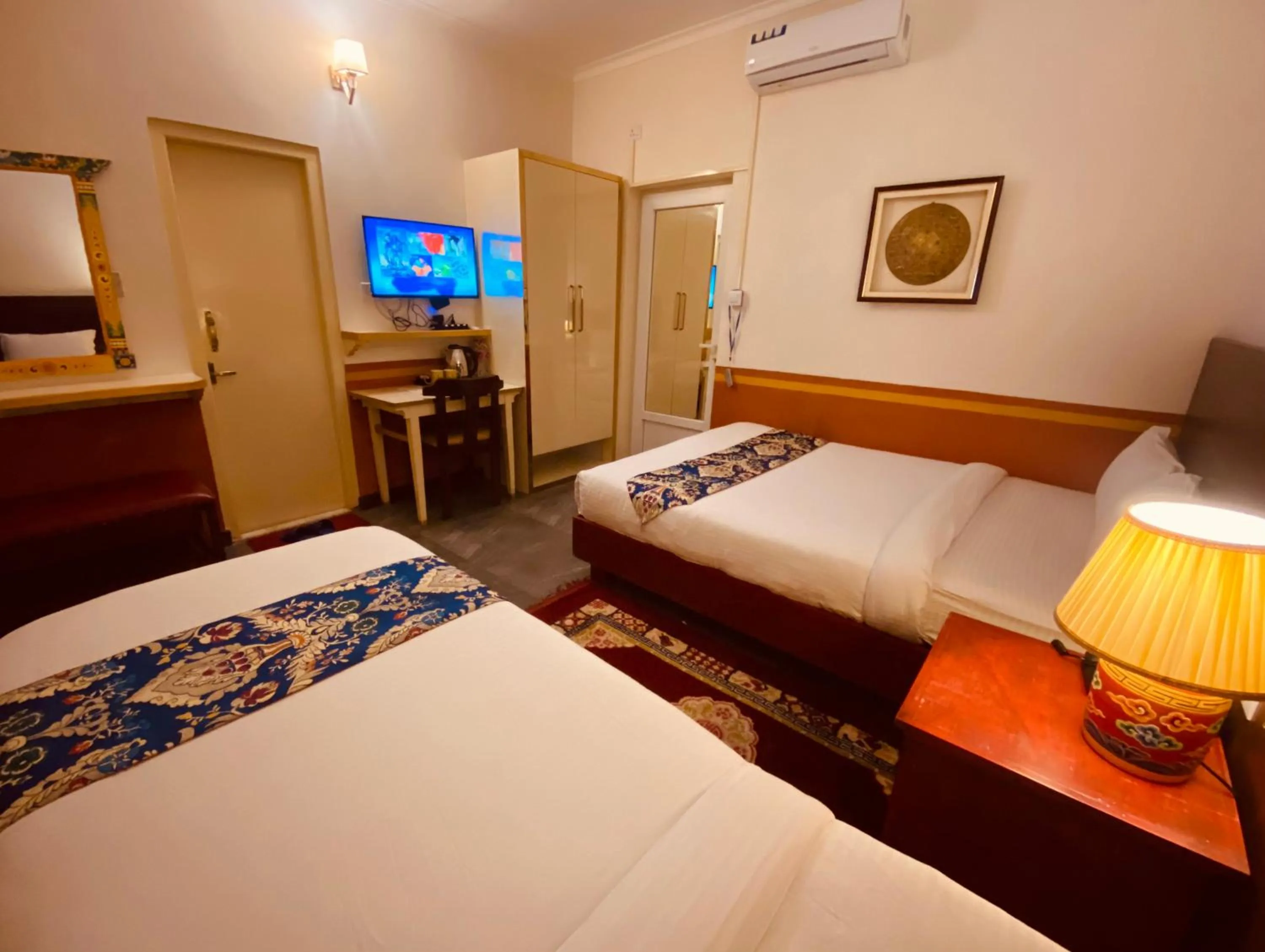 Bed in Three Jewels Boutique Hotel