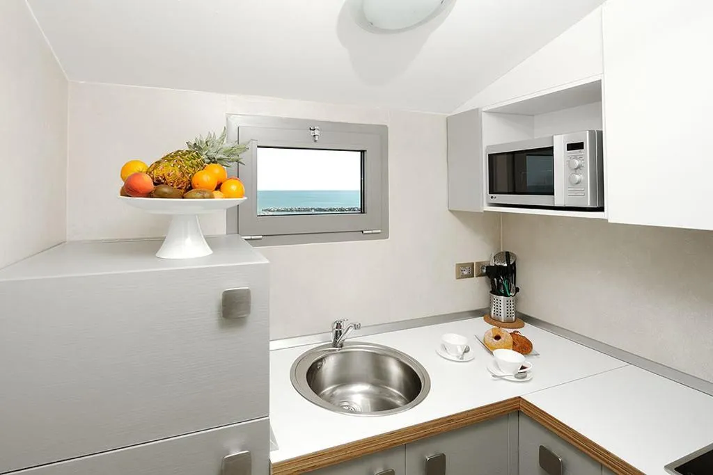 Kitchen or kitchenette in Hotel & Residence Cavalluccio Marino