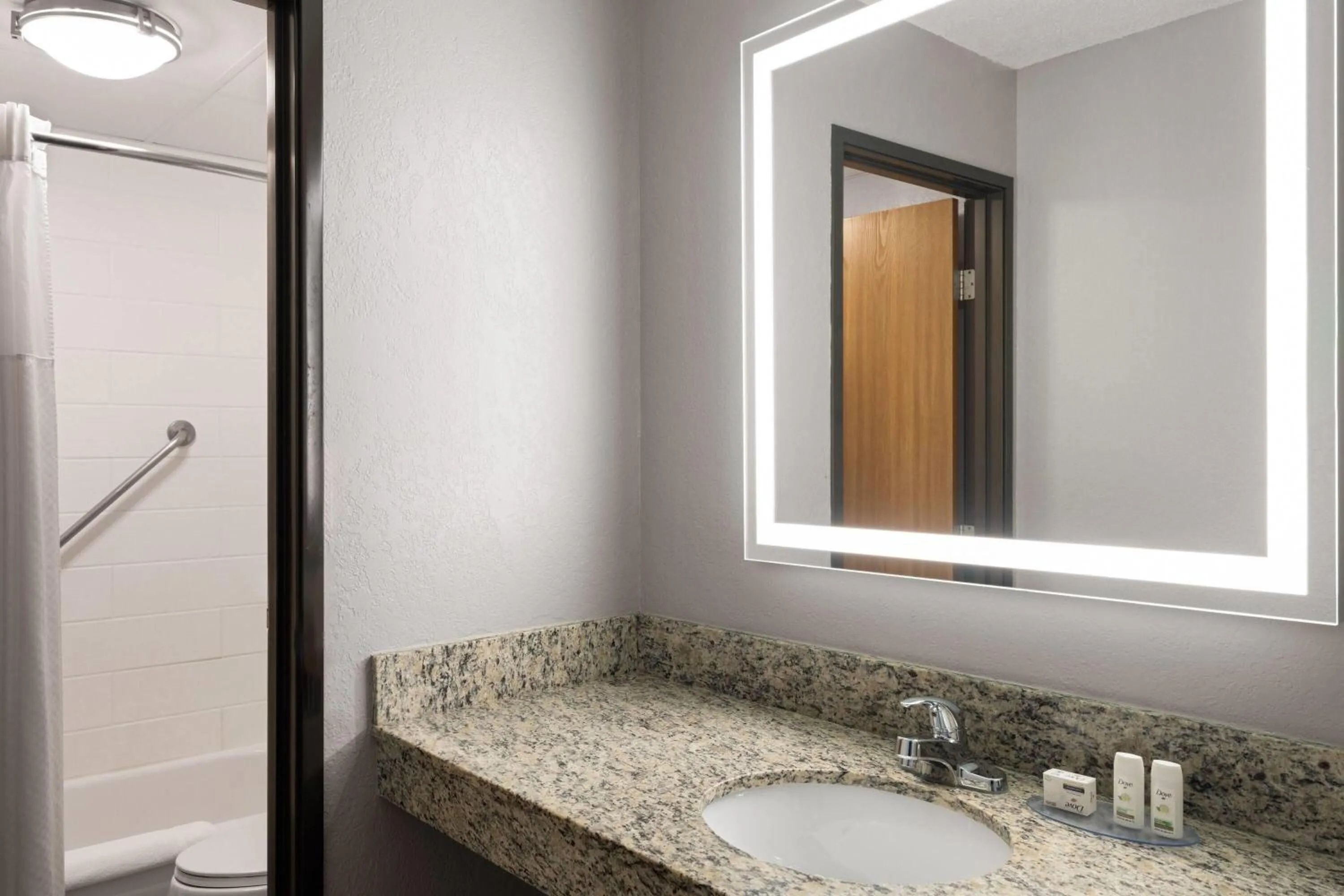 Bathroom in AmericInn by Wyndham Alexandria