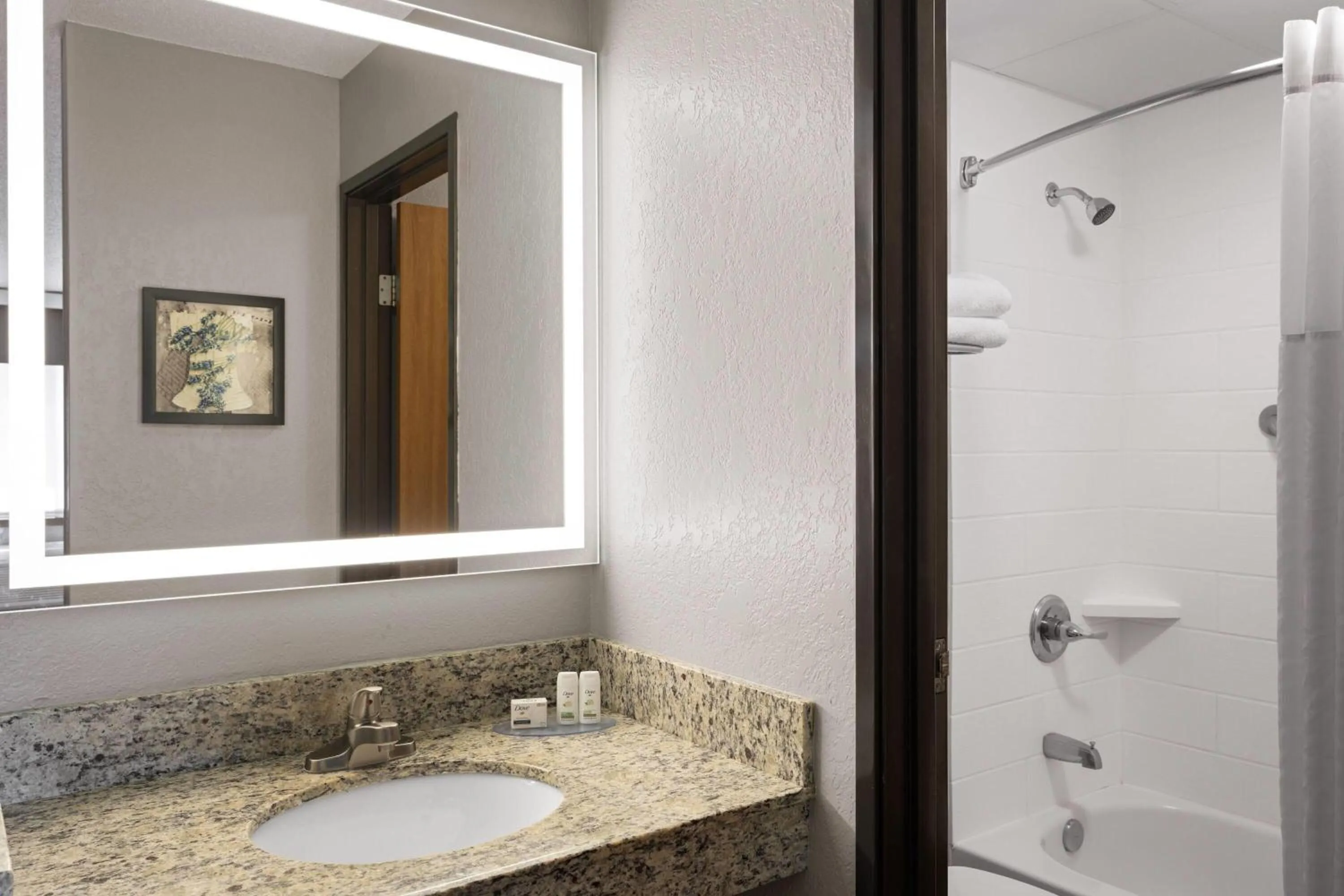 Bathroom in AmericInn by Wyndham Alexandria