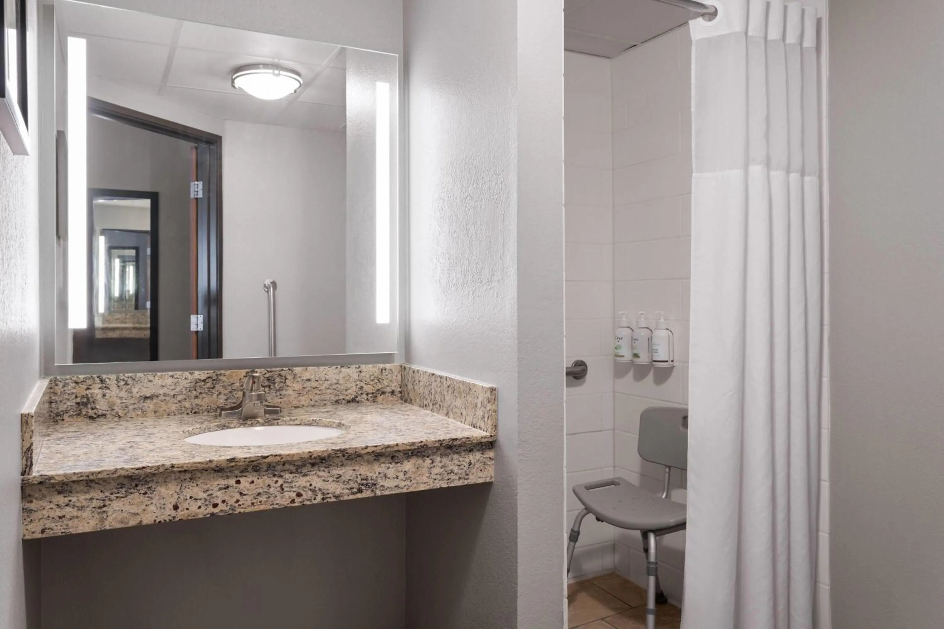 Shower in AmericInn by Wyndham Alexandria