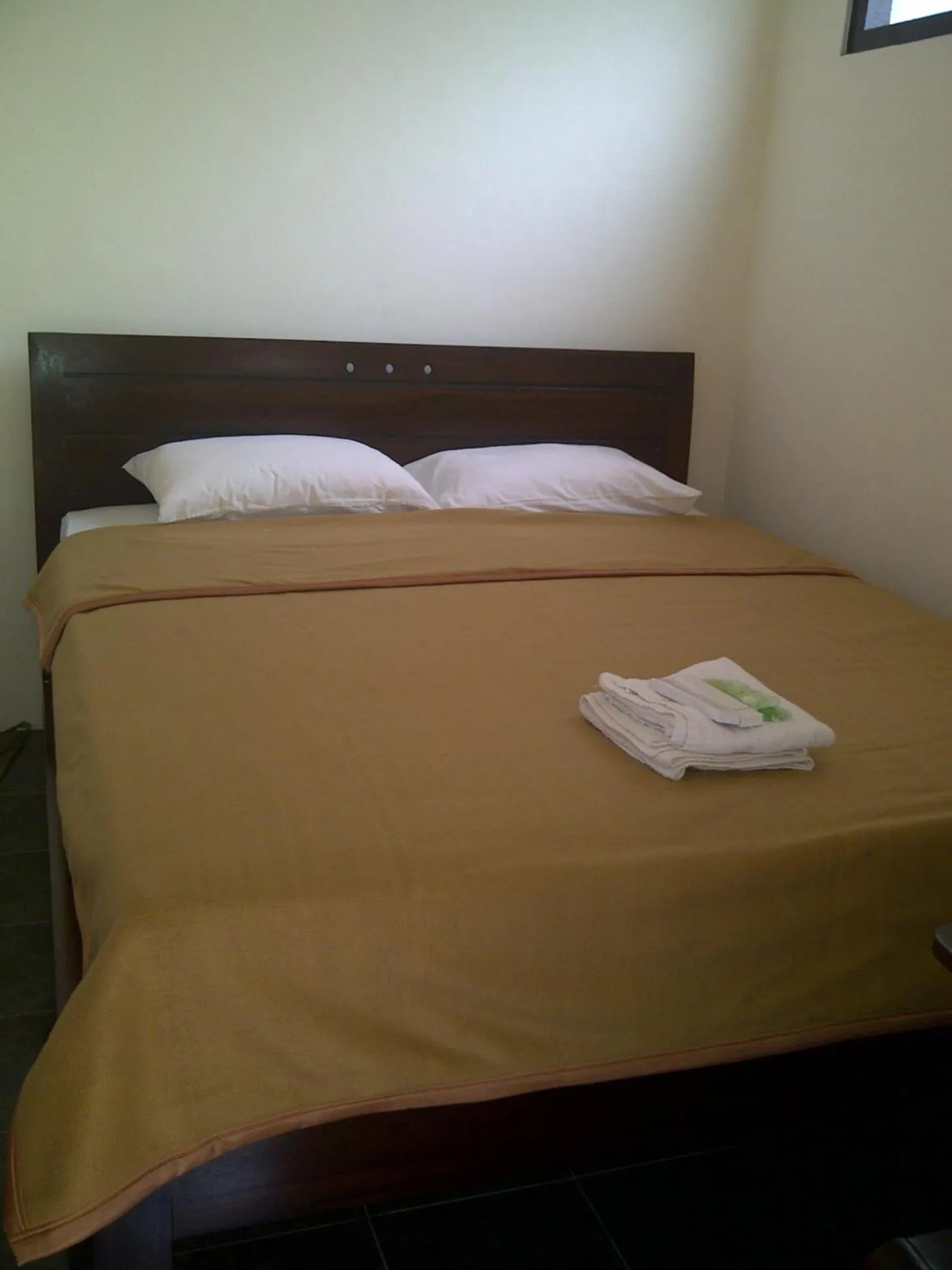 Bed in Ndalem Suratin Guesthouse