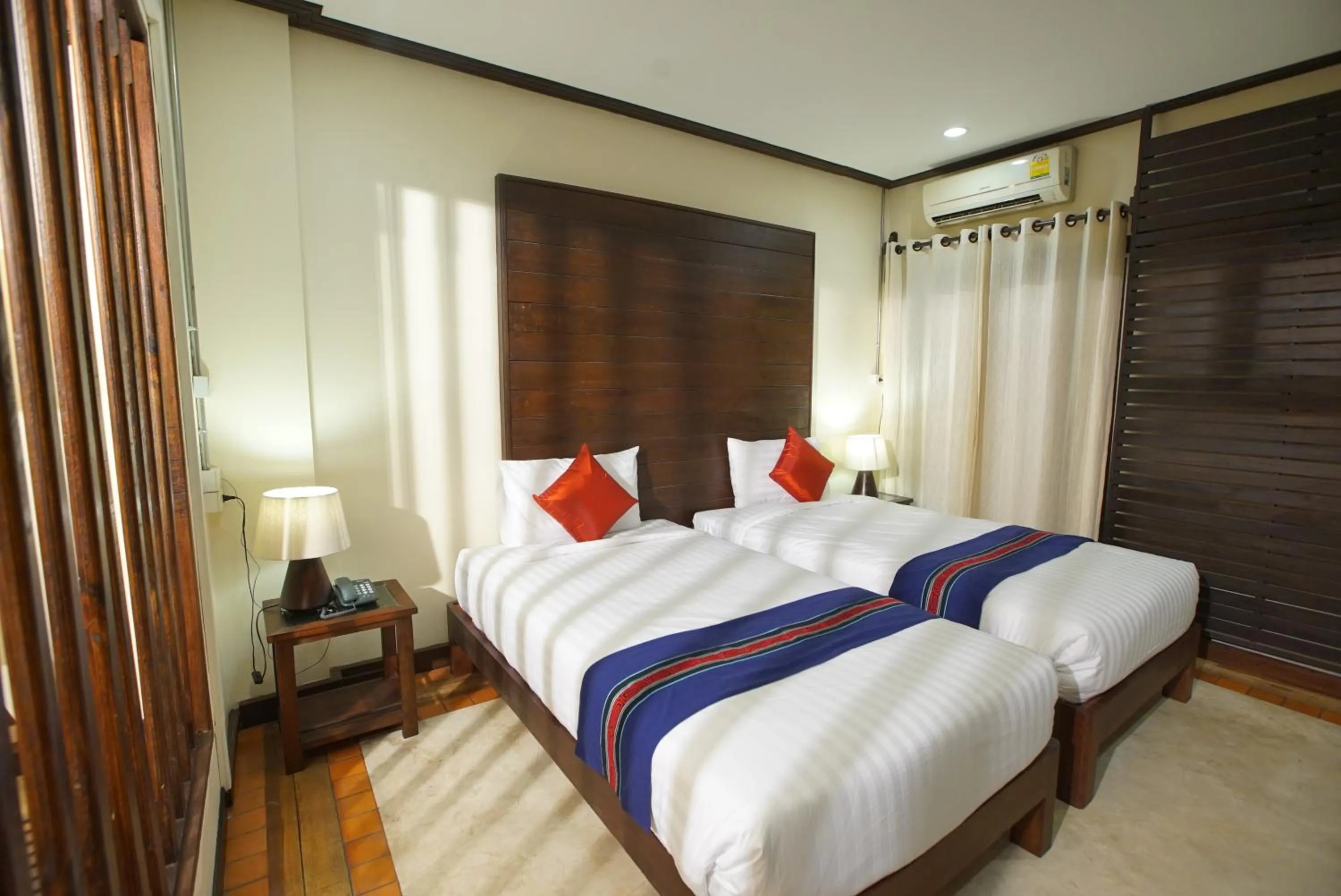 Bed in Sunny V Hotel