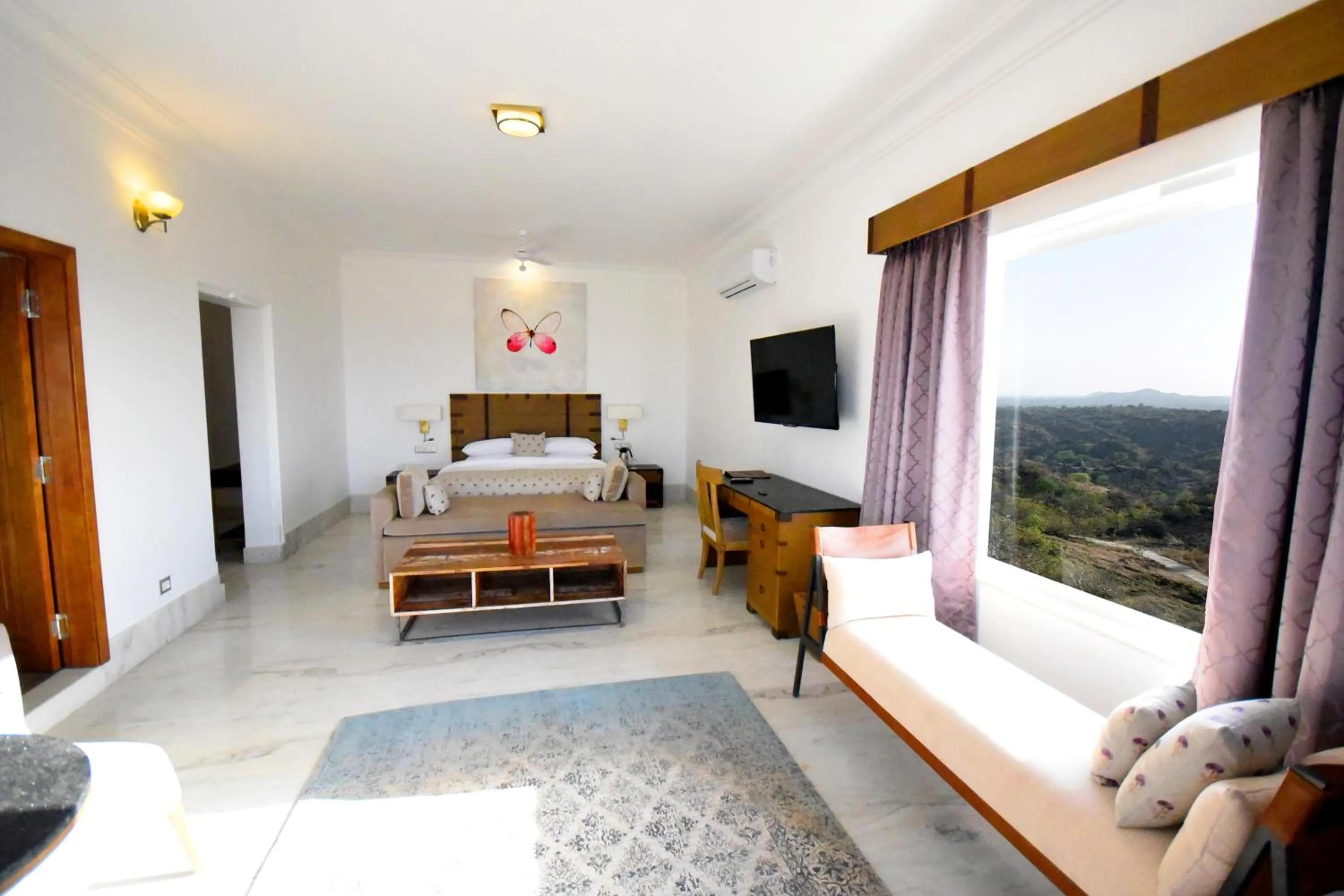 Living room, Bed in Fateh Safari Suites by Fateh Collection