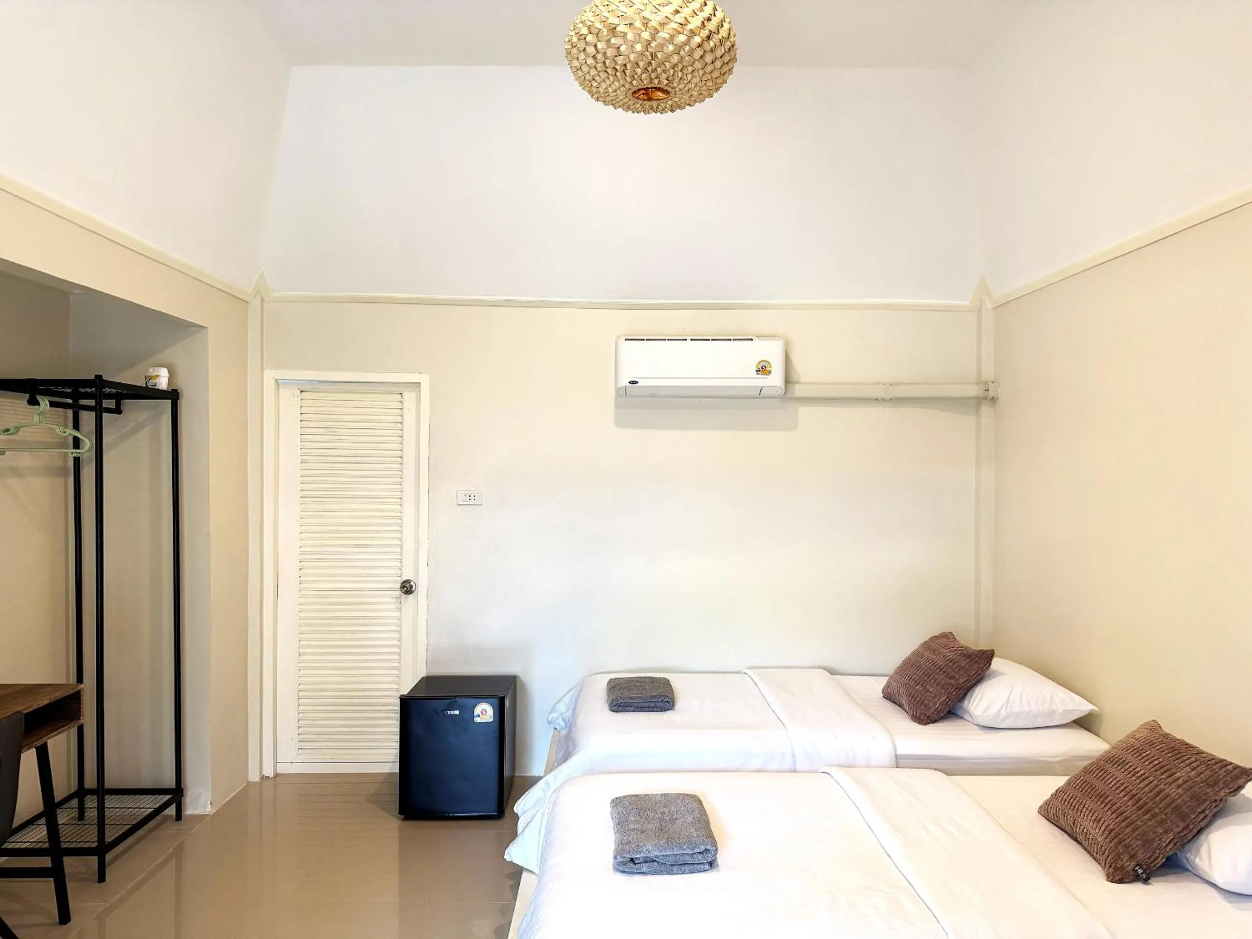 Bed in Sabaii Bay Resort