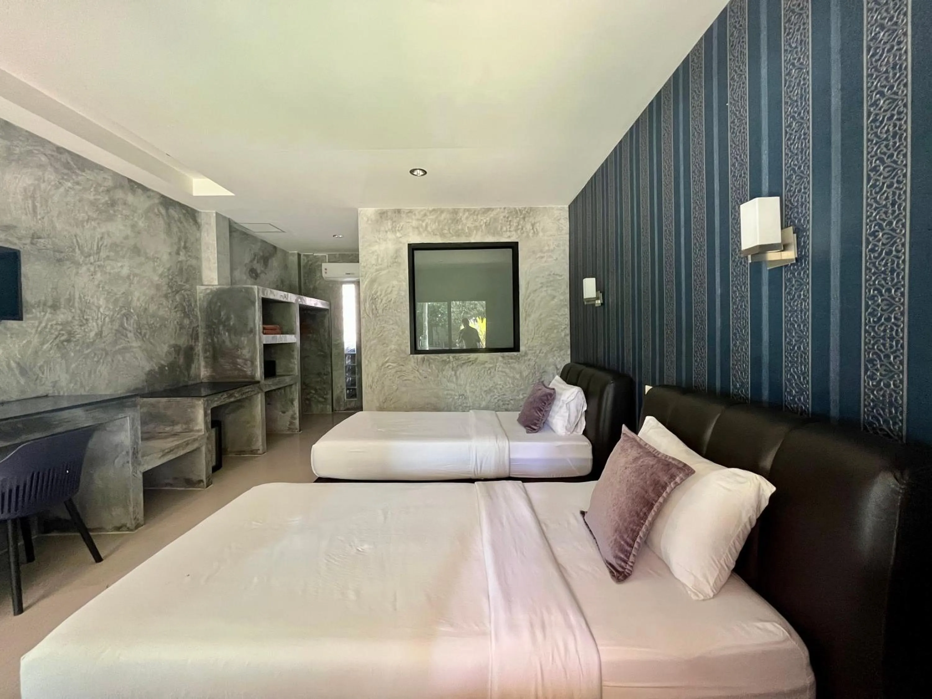 Bed in Sabaii Bay Resort