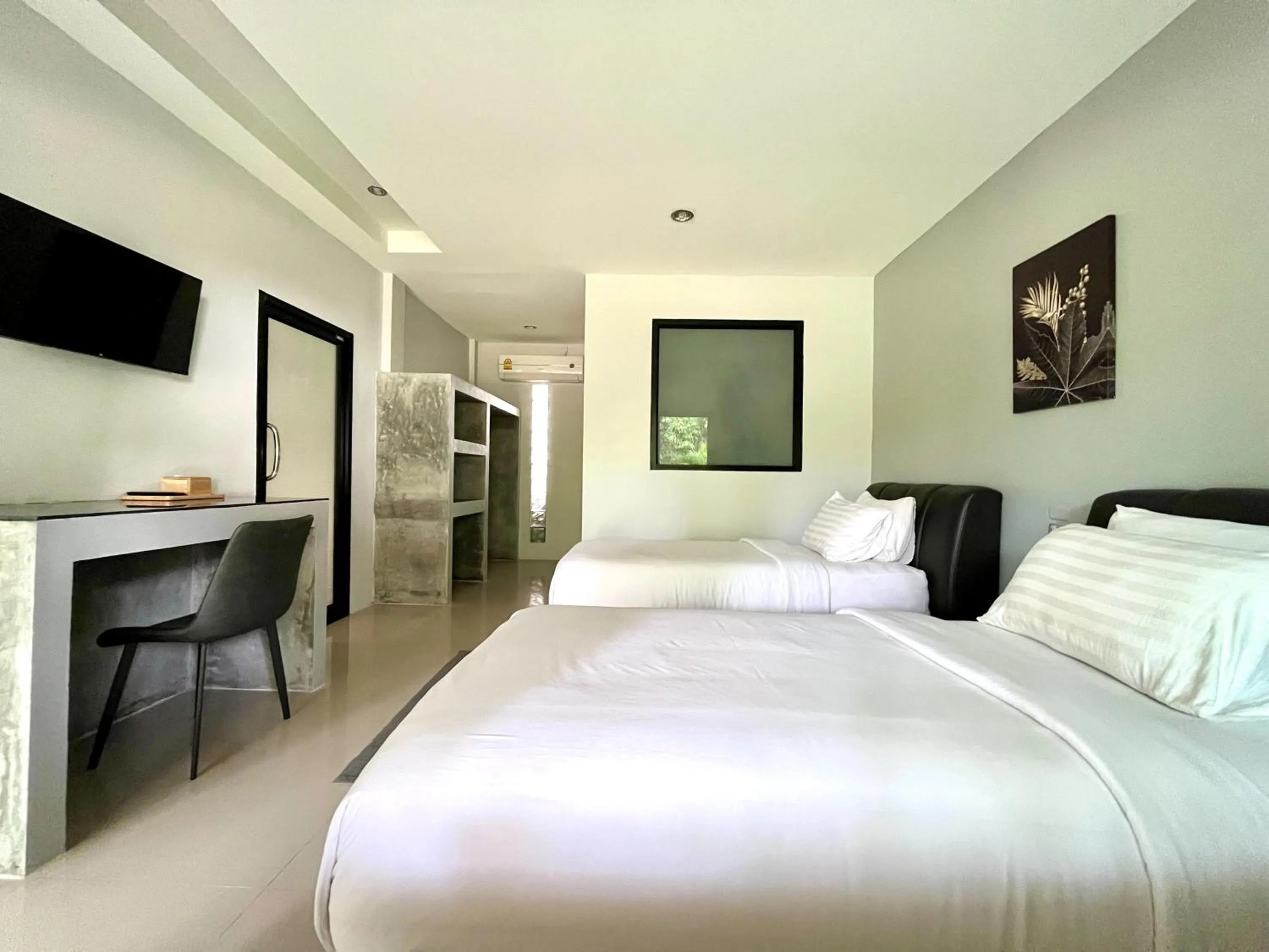 Bed in Sabaii Bay Resort