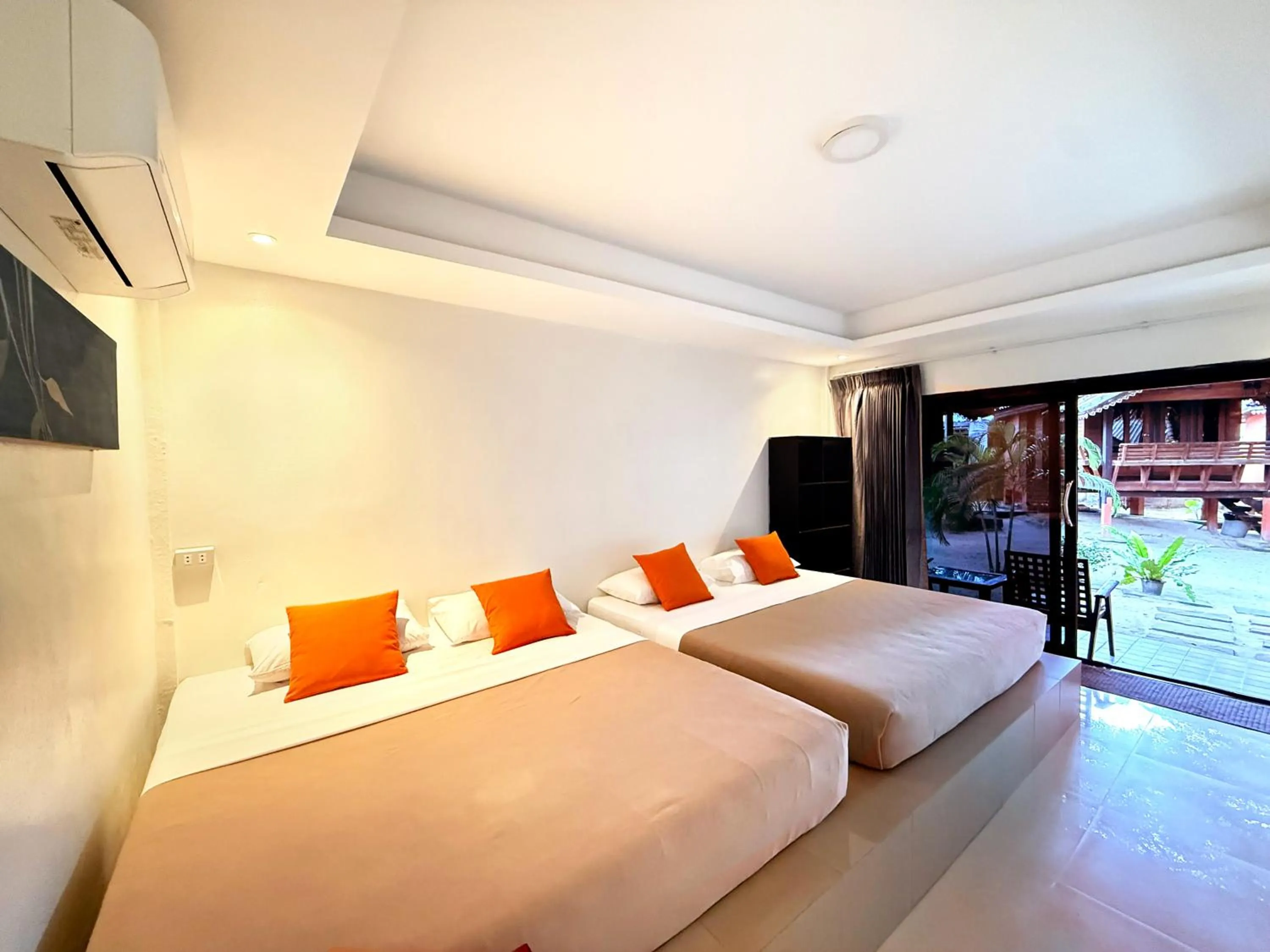 Bed in Sabaii Bay Resort