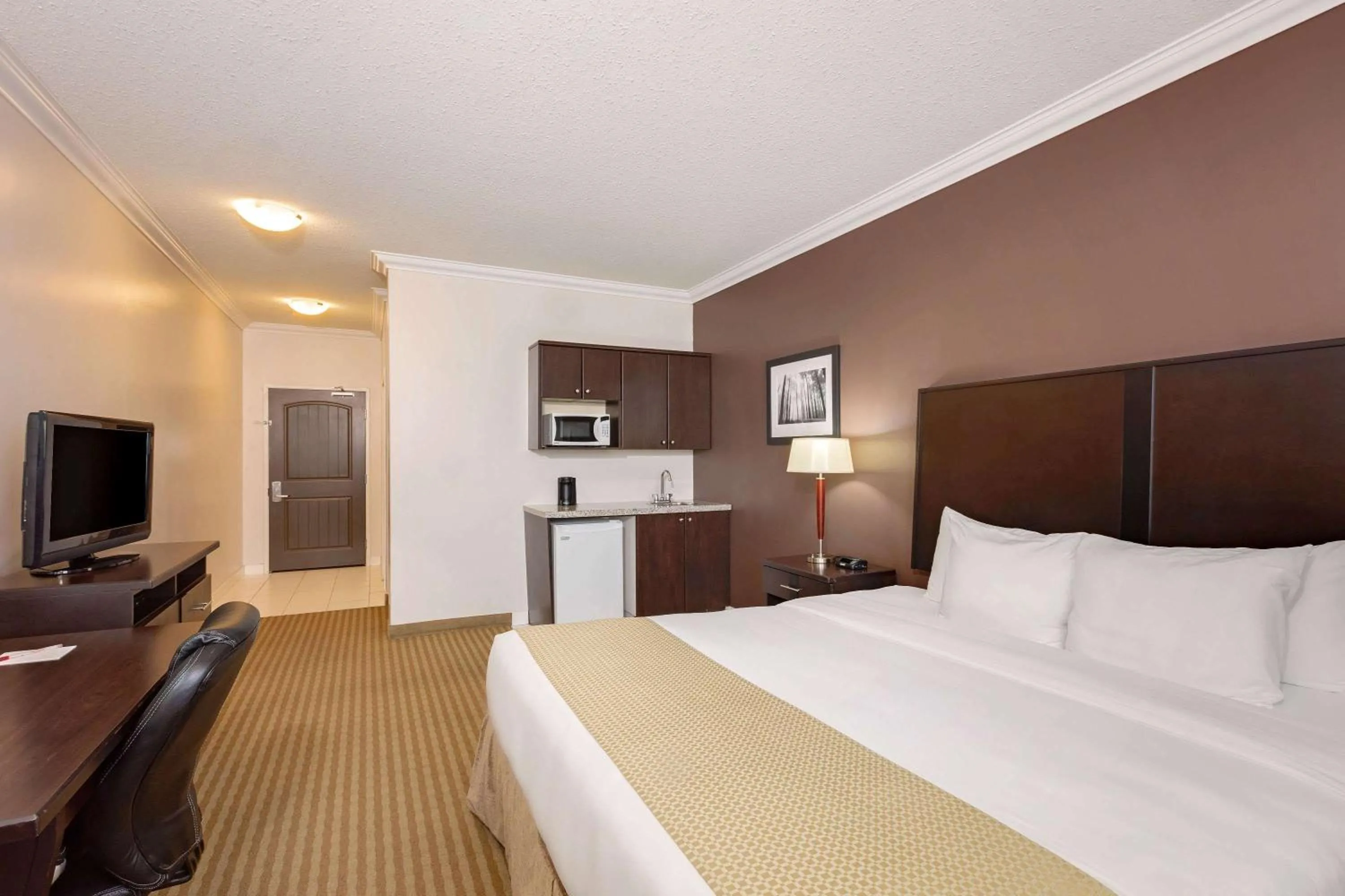 Photo of the whole room, Bed in Ramada by Wyndham Cold Lake