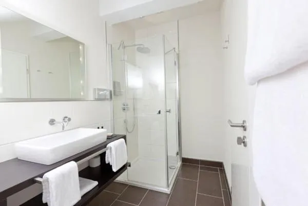 Bathroom in Restaurant Niedmühle Land & Genuss Hotel