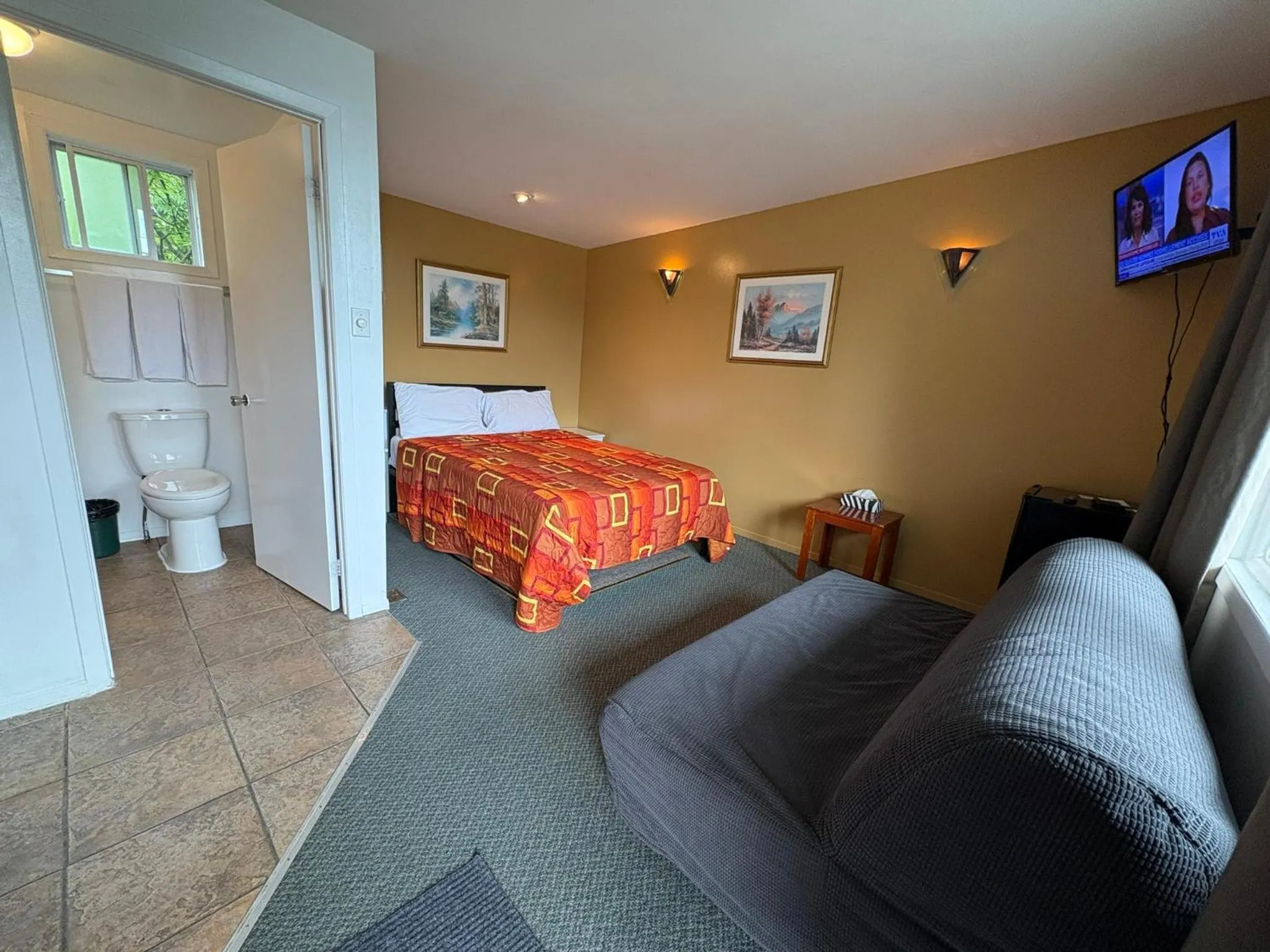 Bed in Motel Le Voyageur