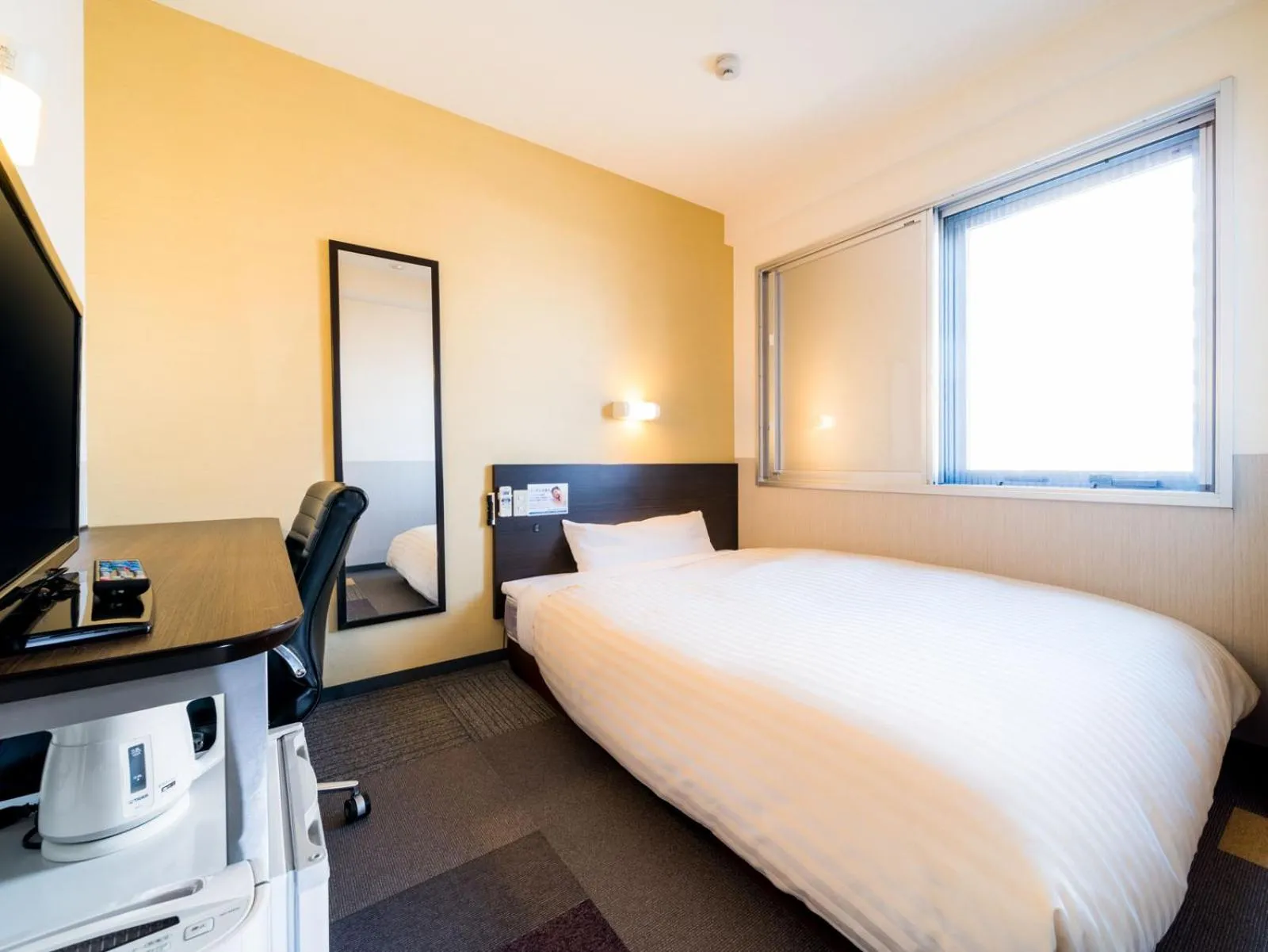 Bed in Super Hotel JR Fuji Station Honkan