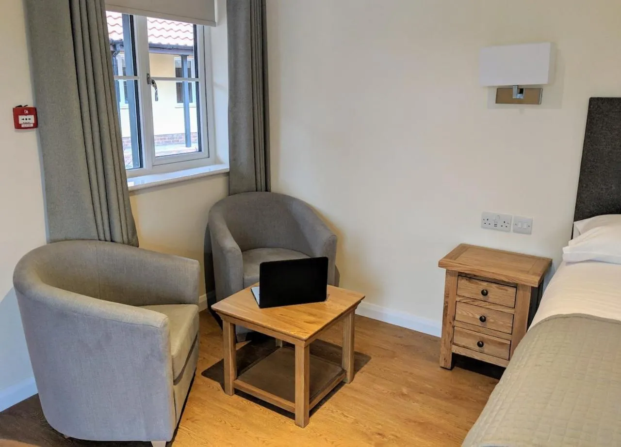 Seating area, Bed in Wayford Bridge Inn Hotel