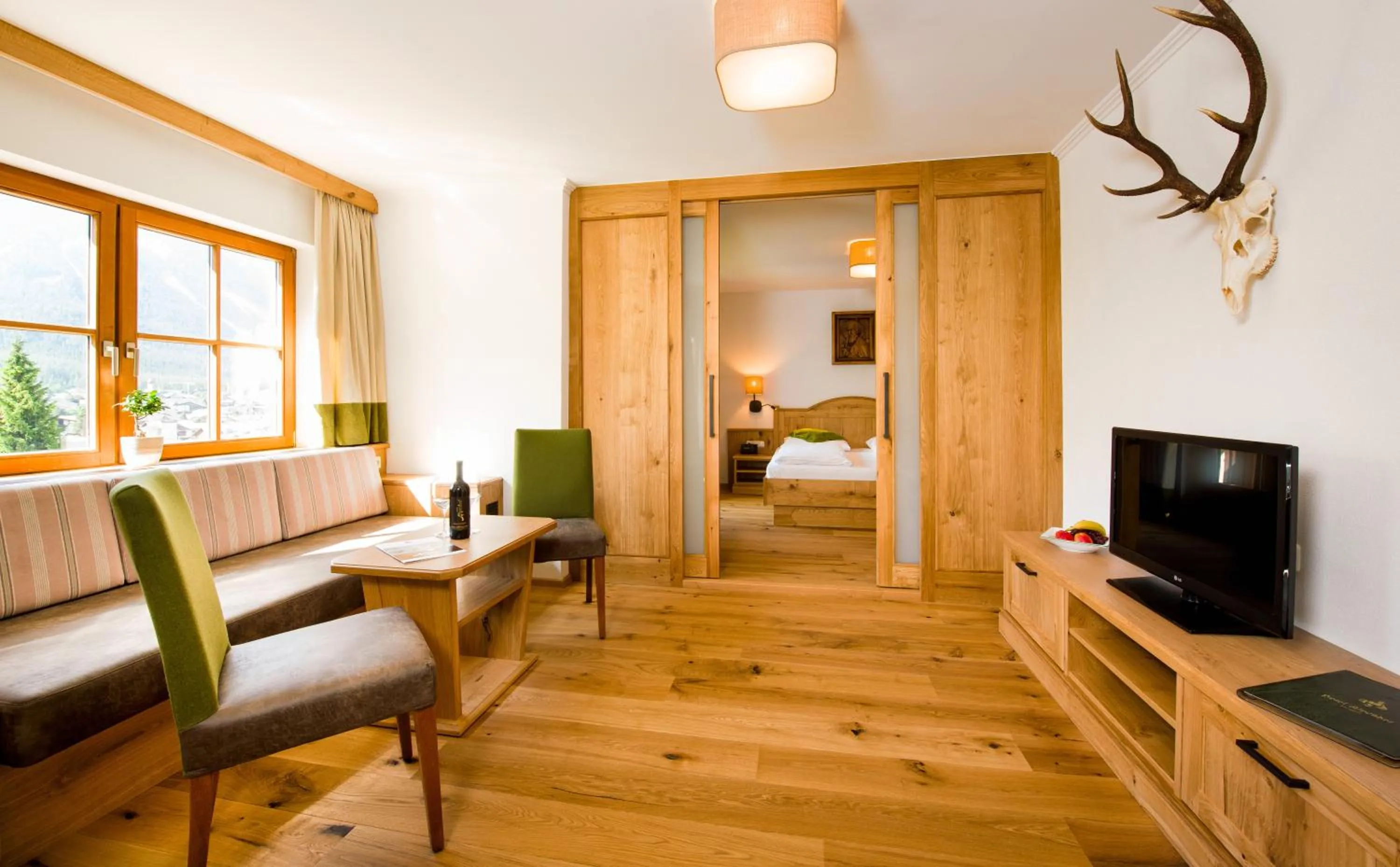 Living room, Bed in Wellness & Sporthotel Alpenhof