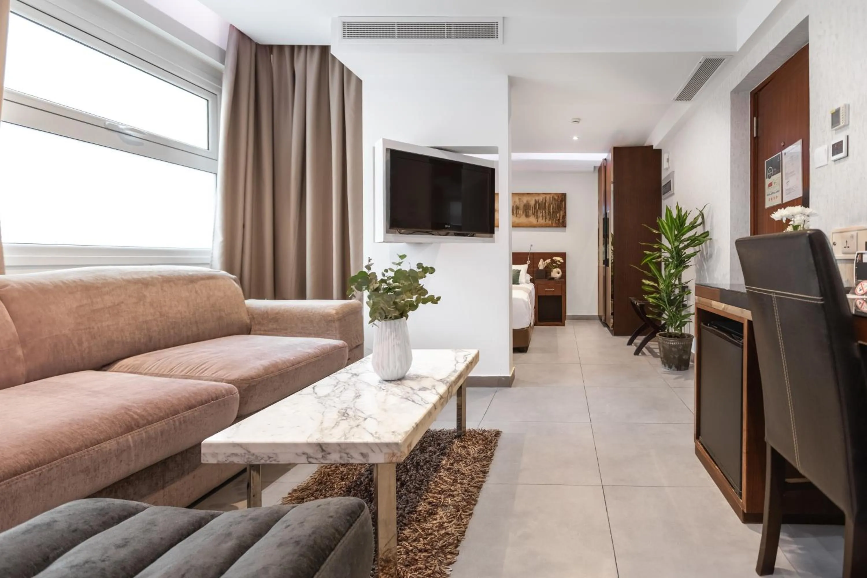 Communal lounge/ TV room in Achilleos City Hotel