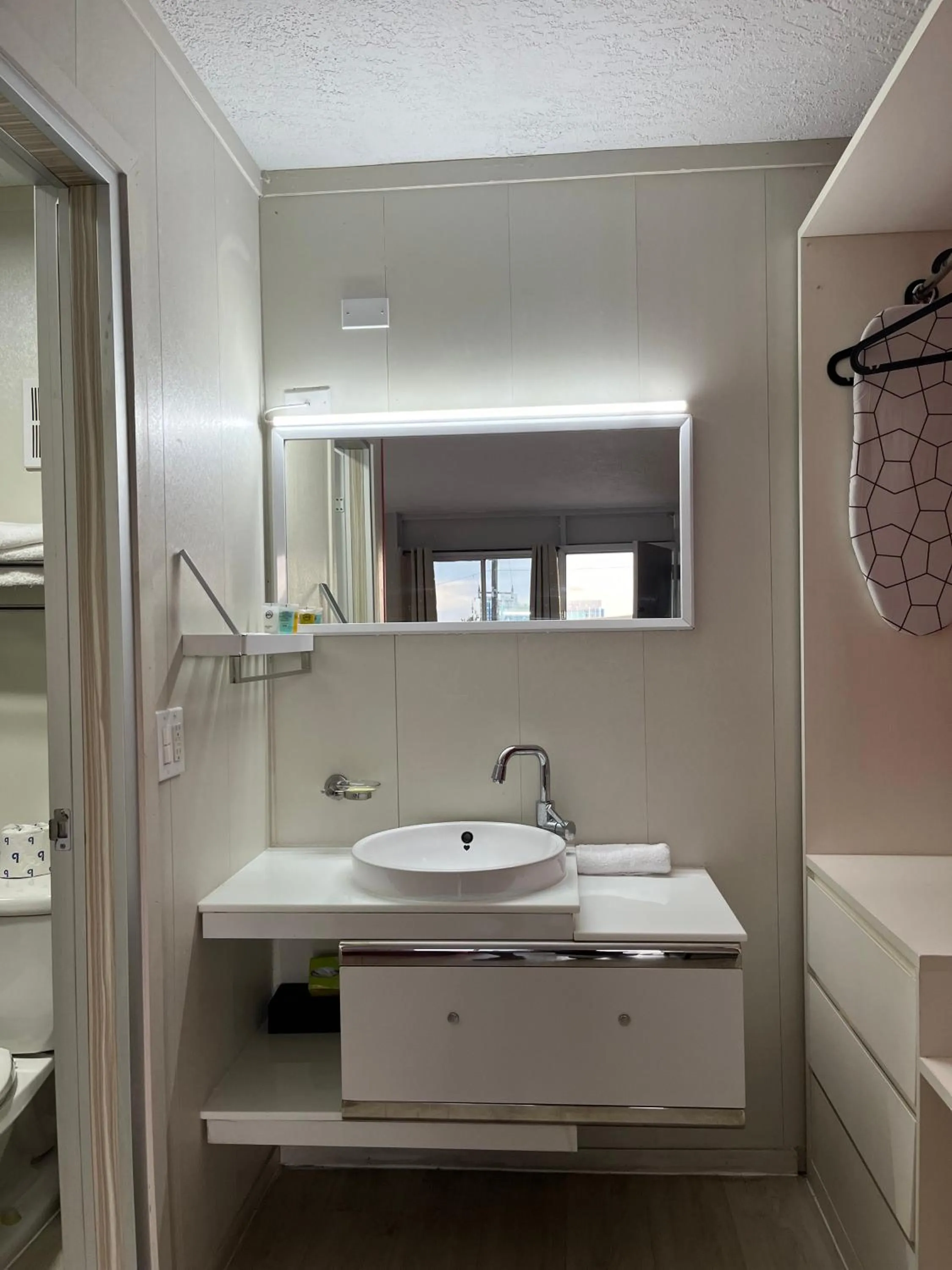 Bathroom in Travelodge by Wyndham Orlando at Heart of International Drive