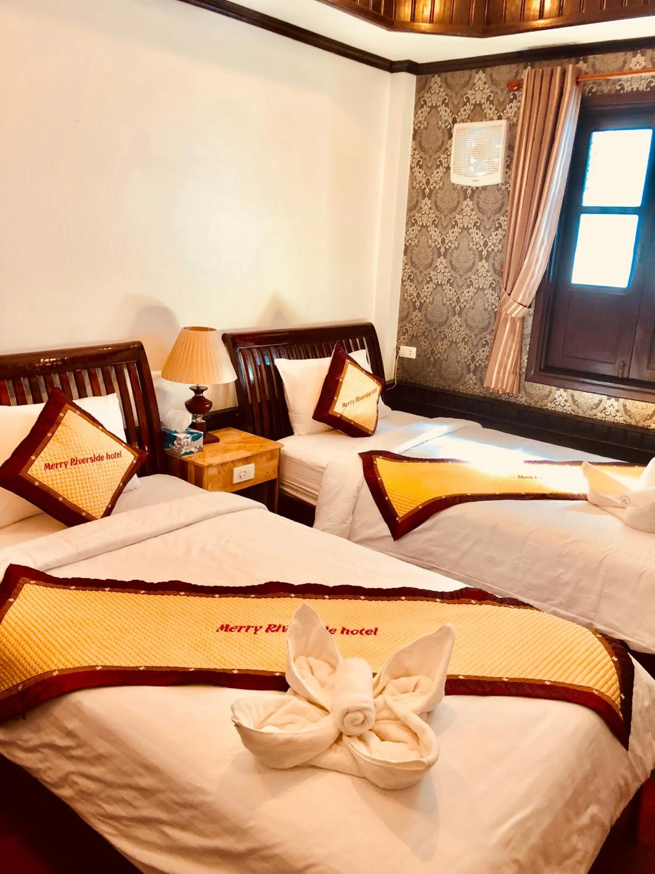 Bed in Merry Riverside Hotel