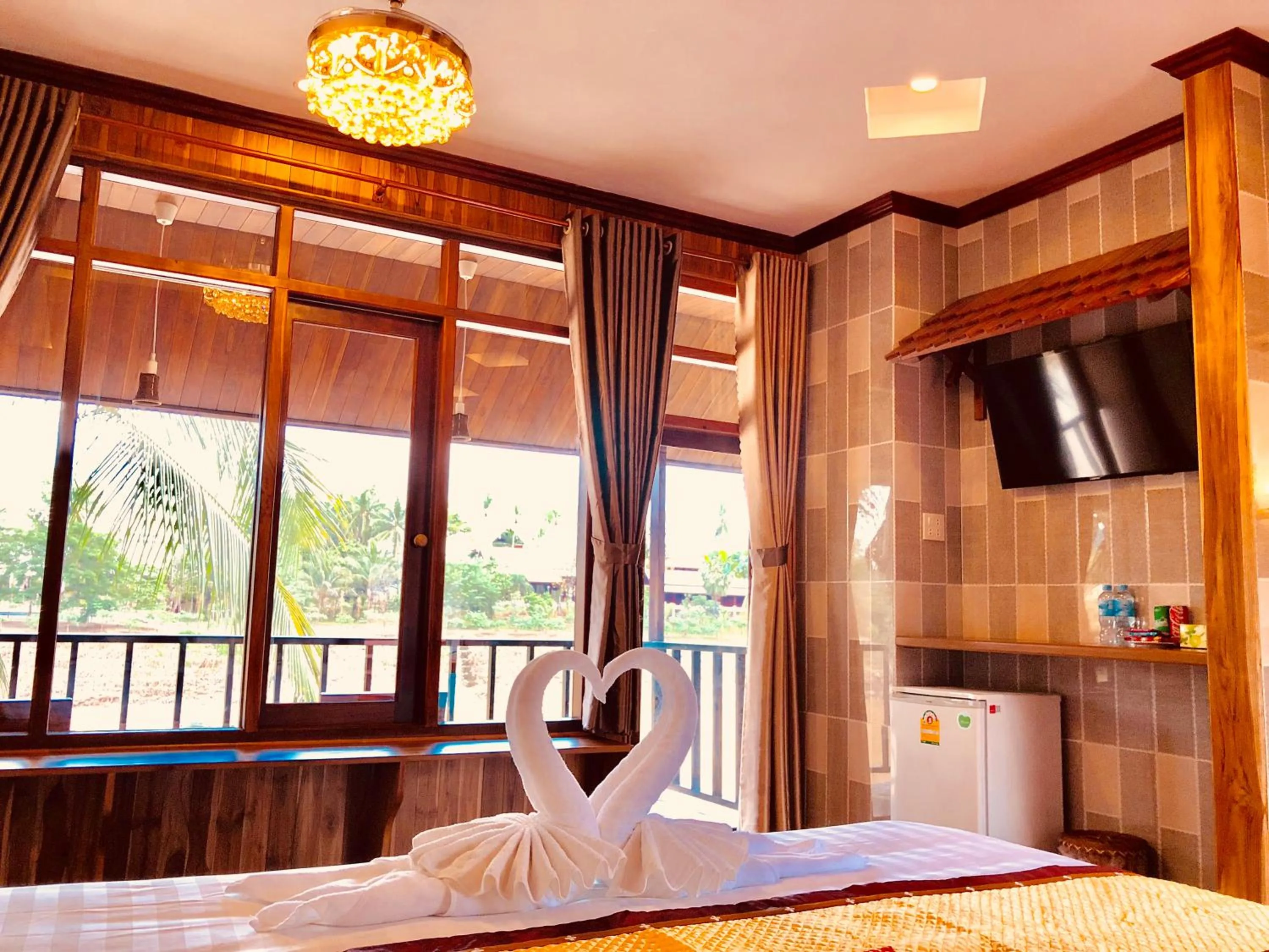 Photo of the whole room, Bed in Merry Riverside Hotel